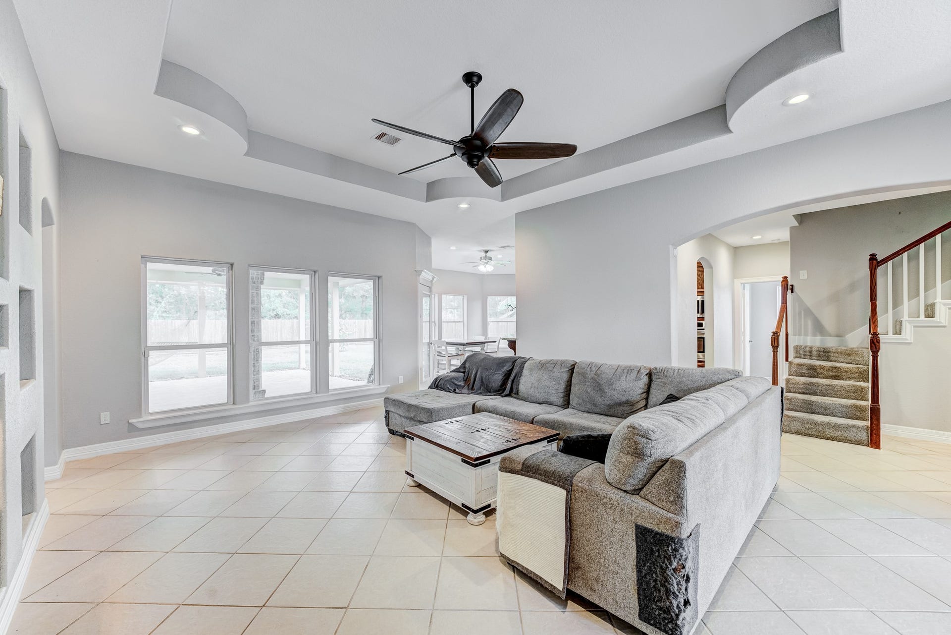 Generous living room offering high ceilings and views of the home's open layout.