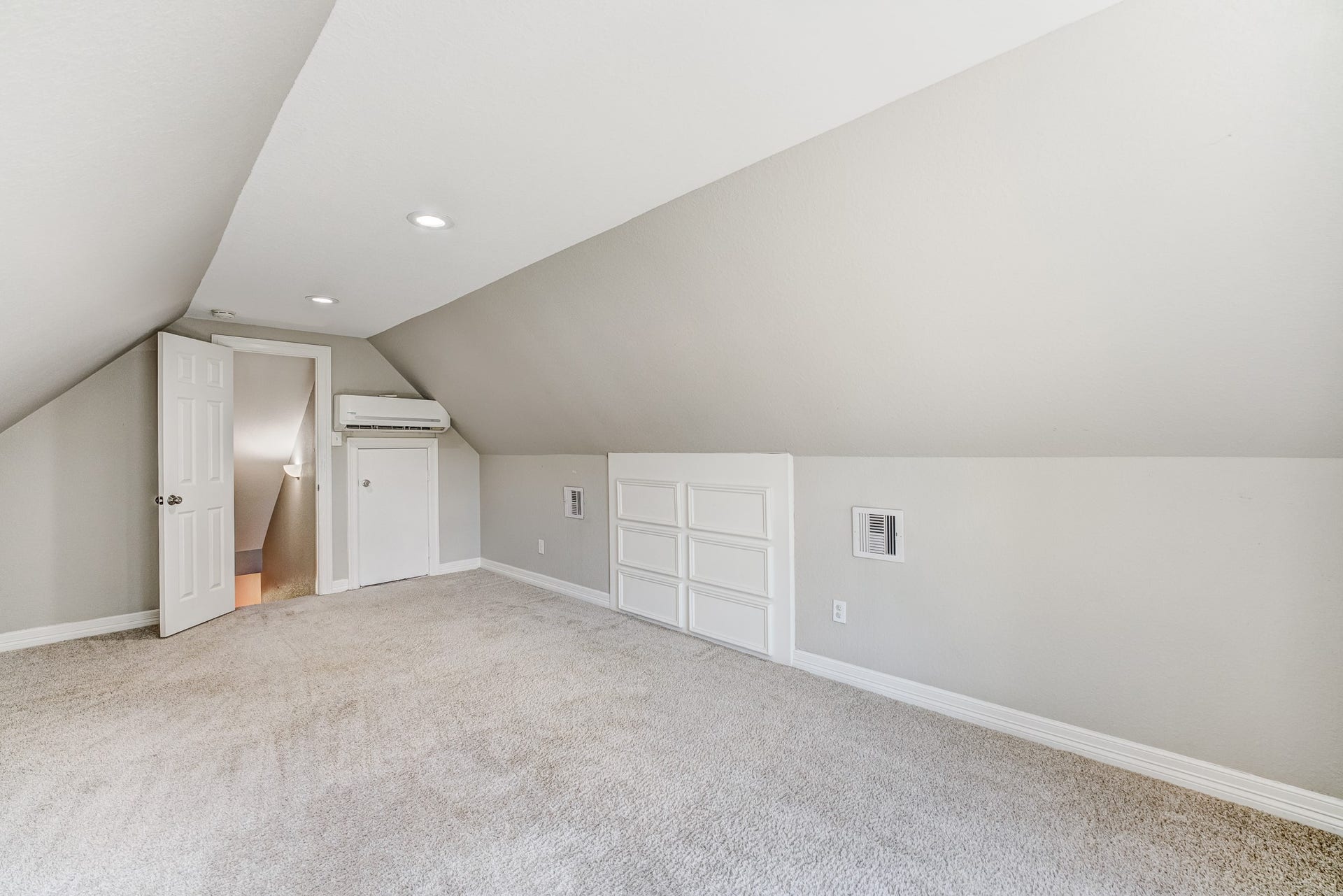Large finished flex space with built-in storage and abundant natural light.