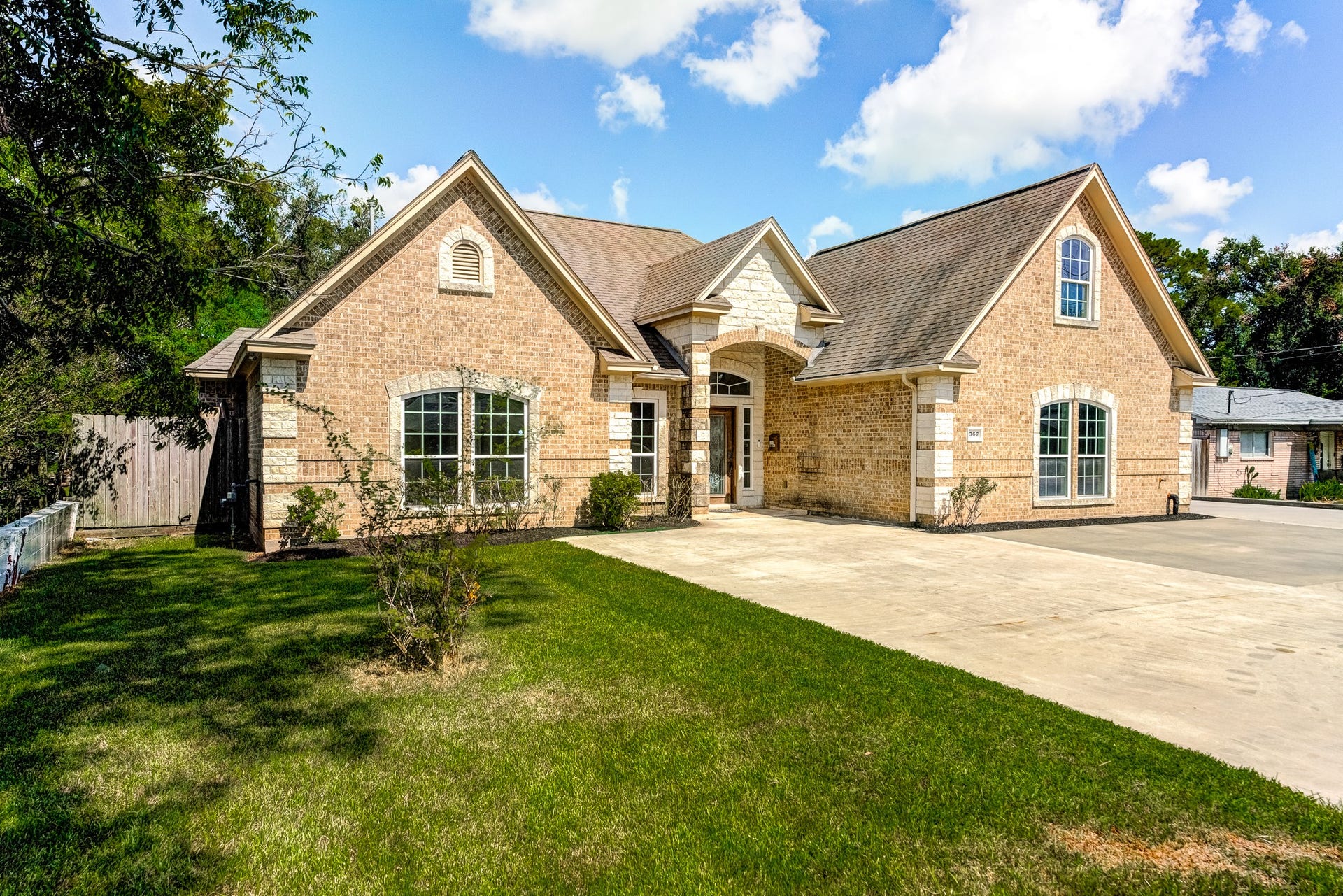 Attractive front elevation featuring mature landscaping and a welcoming design.