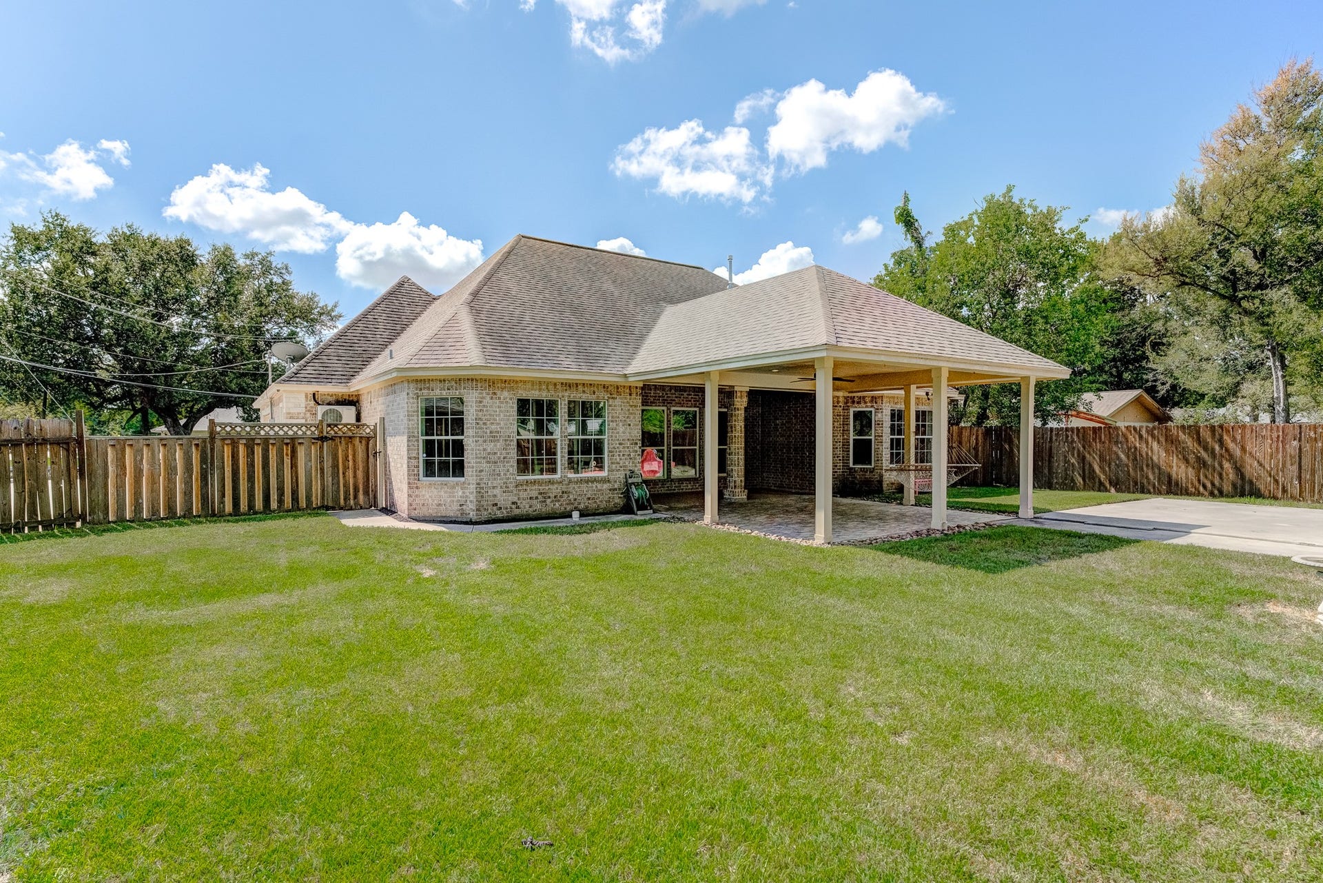 Private backyard with ample room for pets, play, future outdoor amenities, and 100 sf of garden beds.