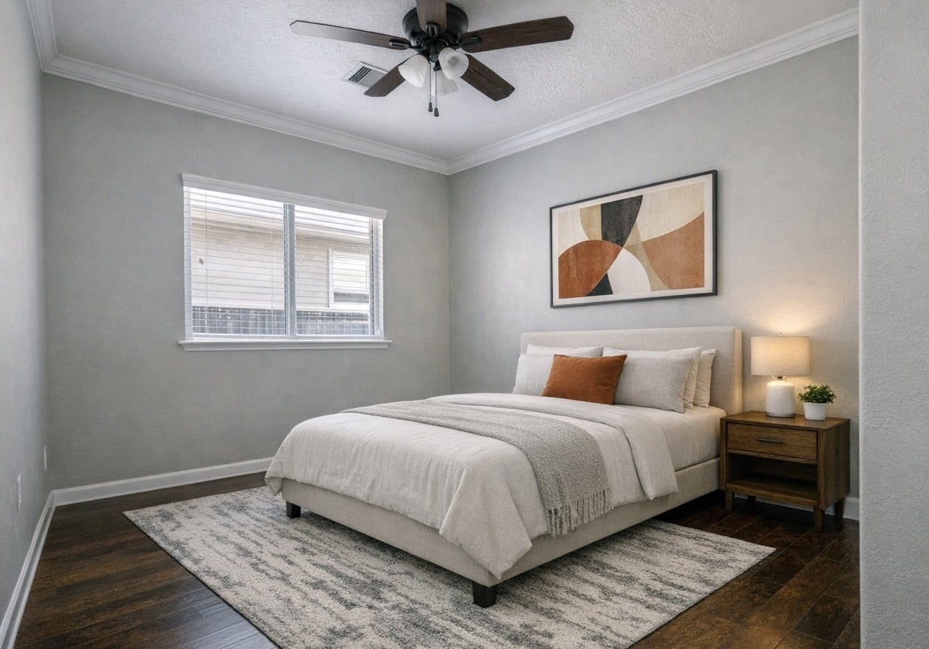 24531 Via Salerno Court, Richmond, TX 77406 AI Staged photo of bedroom 2
features large windows, hardwood
floors and closet.