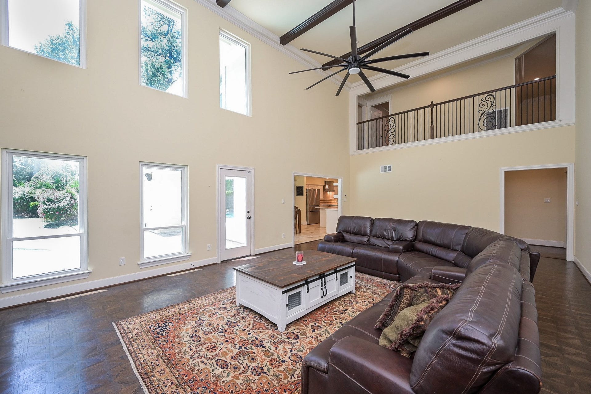 The room opens to the outdoors and the kitchen area.