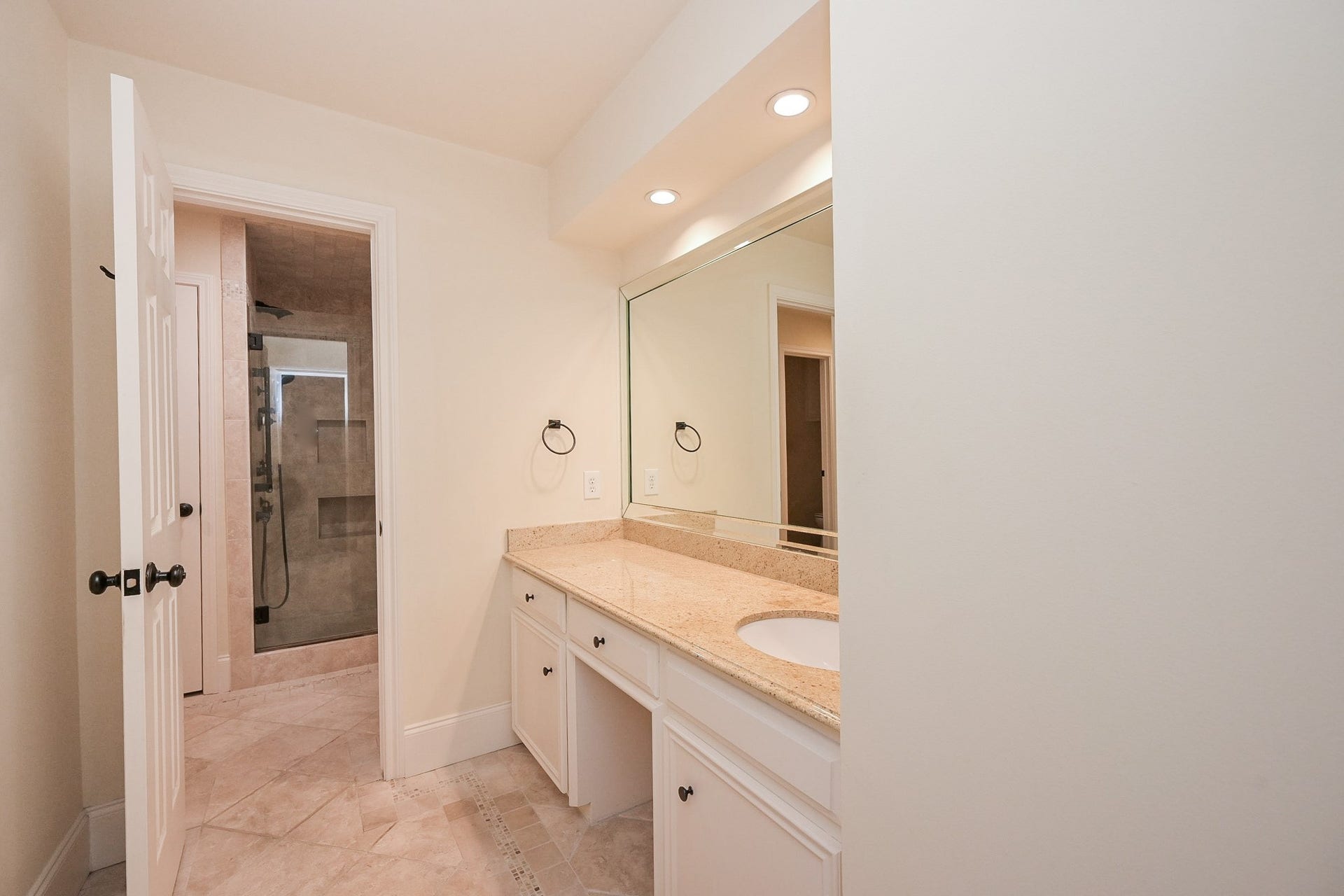 Private vanity area and closet in hollywood bath