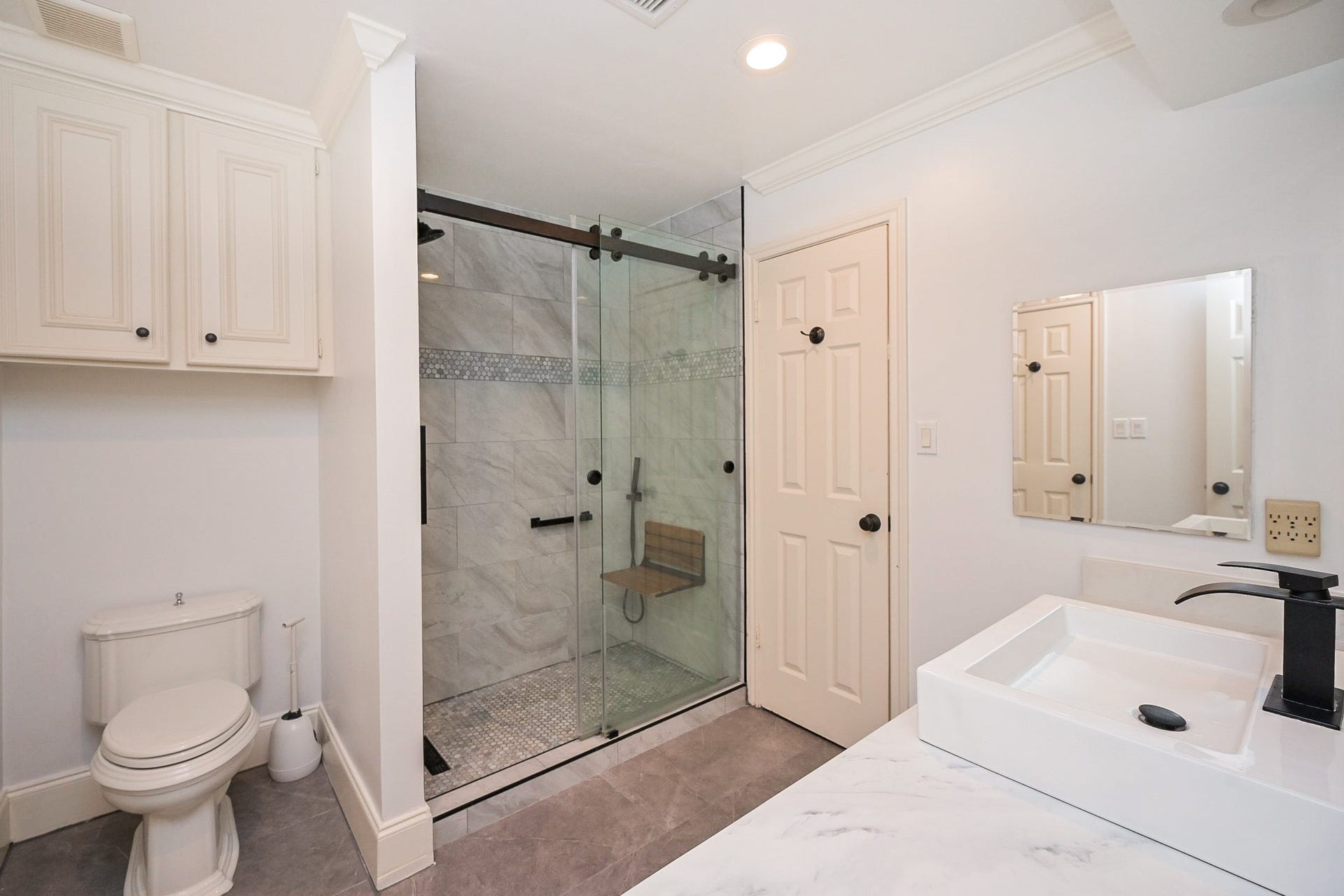 Recently updated bath with walk in shower and access to 2 bedrooms and hallway