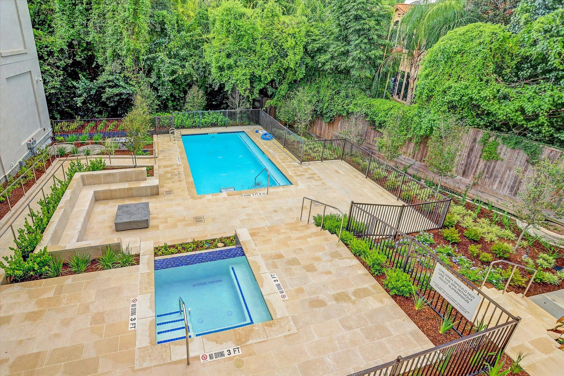 6017 Memorial Drive, #505, Houston, TX 77007 Escape to The Sophie's beautifully landscaped outdoor retreat, featuring a heated resistance pool and separate heated spa. Surrounded by lush greenery, elegant stone decking, and thoughtfully designed seating areas, this intimate setting offers a peaceful escape from the city. The secluded atmosphere reflects the building's boutique character, providing residents with a private, resort-inspired environment for relaxation, recreation, and everyday enjoyment.