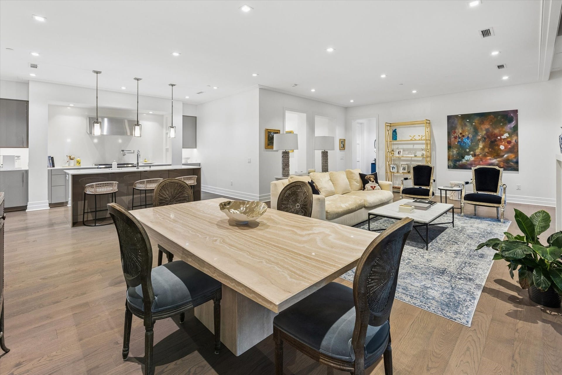 6017 Memorial Drive, #505, Houston, TX 77007 This beautifully integrated living and dining area showcases the residence's spacious open-concept design. Rich Listone Giordano engineered hardwood flooring, high ceilings, and clean architectural lines create an atmosphere of understated sophistication. The dining area transitions effortlessly into the inviting living room and European-inspired kitchen, offering an elegant setting for everything from intimate dinners to larger gatherings with family and friends.