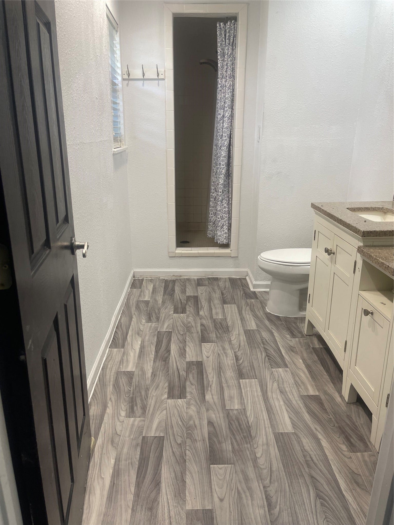 5001 Texas Avenue, La Marque, TX 77568 Primary en-suite bathroom with updated double sinks and walk-in shower