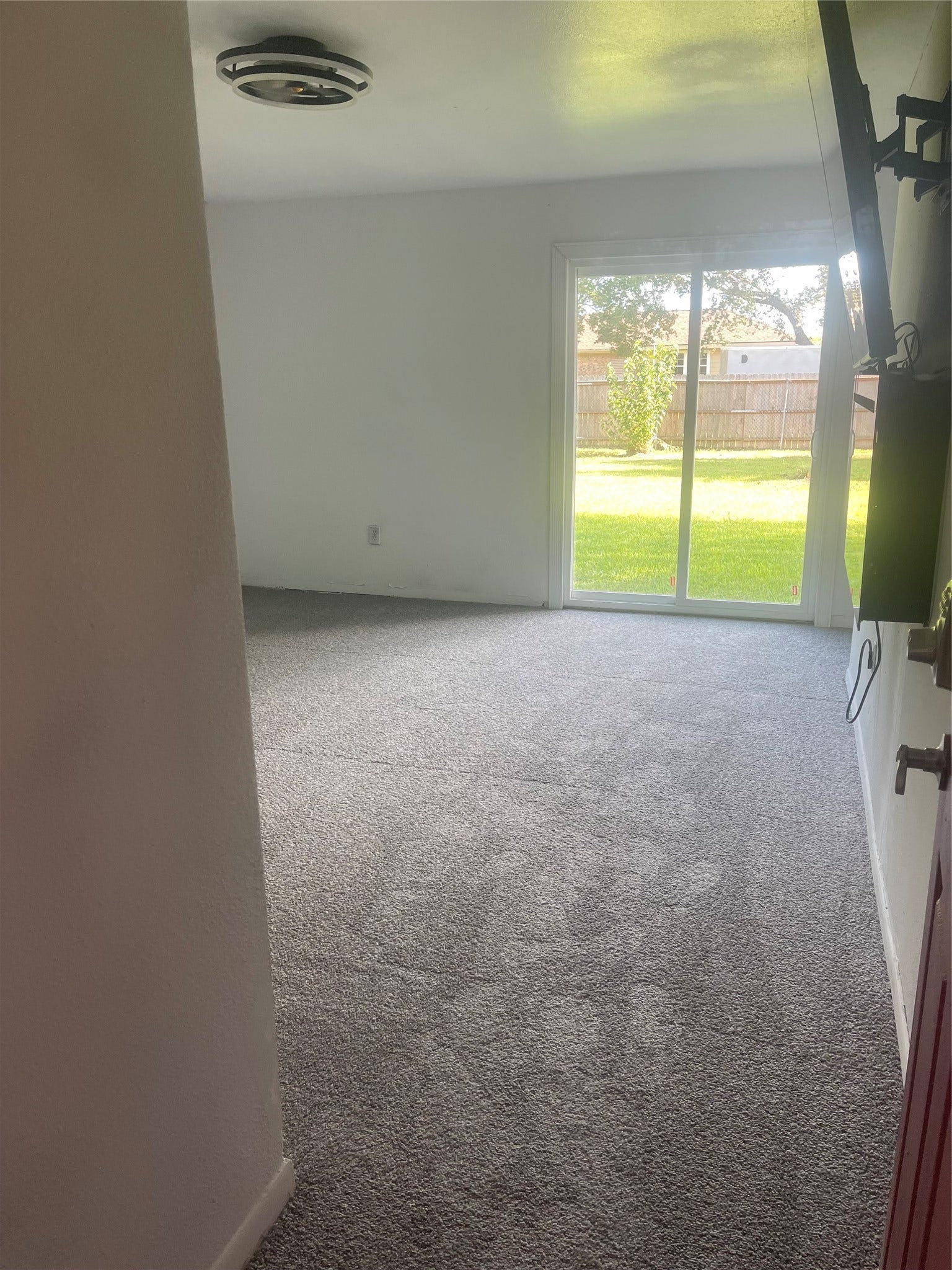 5001 Texas Avenue, La Marque, TX 77568 Primary bedroom with lots of natural lighting and a sliding door to the backyard