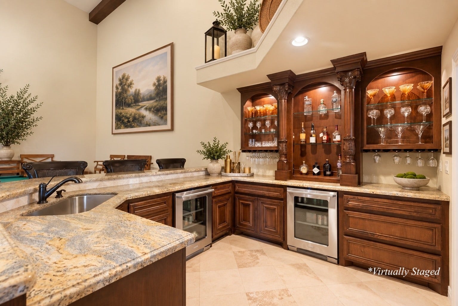 Custom full-service bar featuring granite  countertops, beverage refrigerators, extensive cabinetry, and wrap-around seatingperfect for serving cocktails while entertaining in the spectacular Game & Trophy Lounge. *Virtually Staged with some decor accents