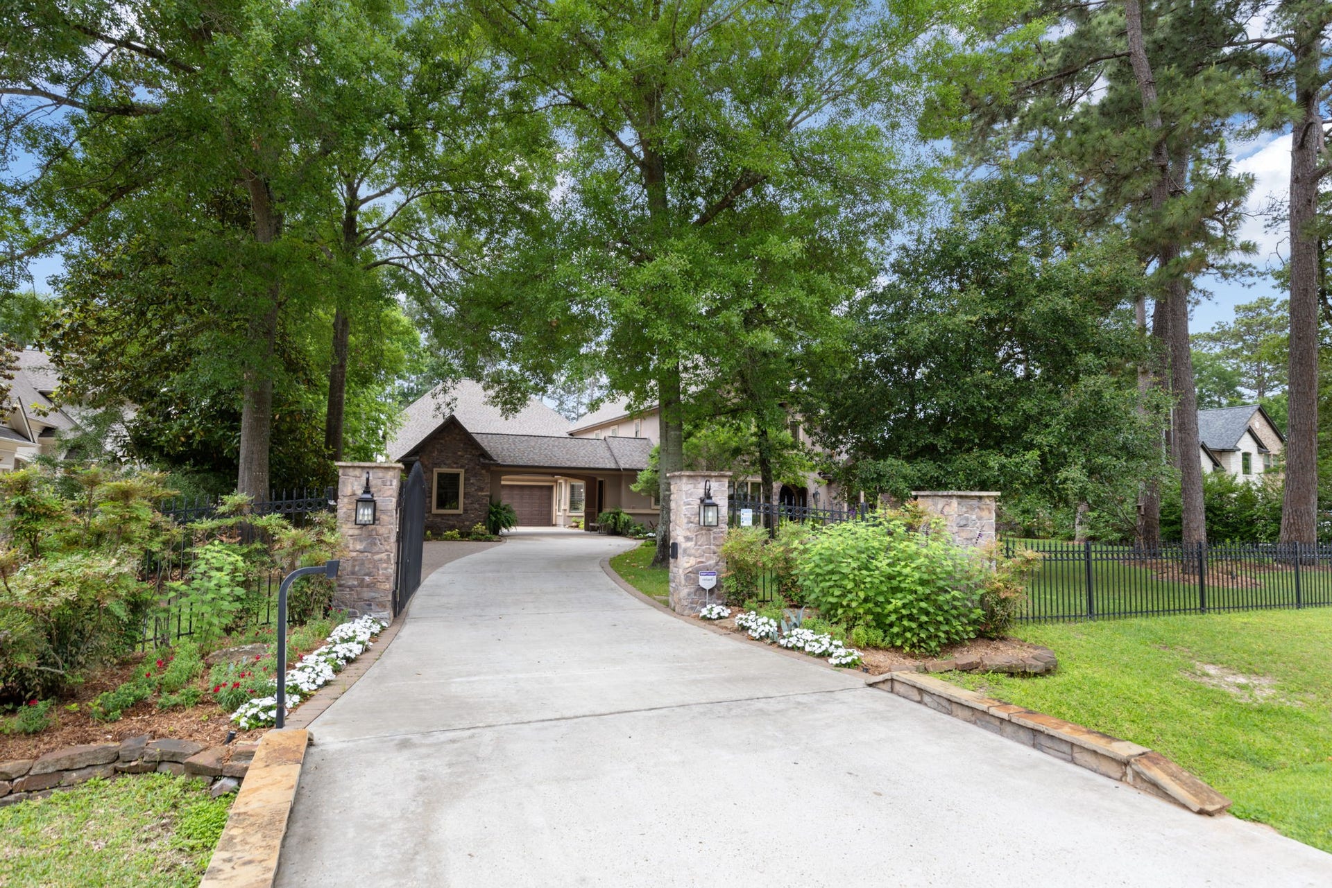 Private gated entry, extra parking, porte-cochre, and exceptional curb appeal welcome you to this one-of-a-kind waterfront estate.