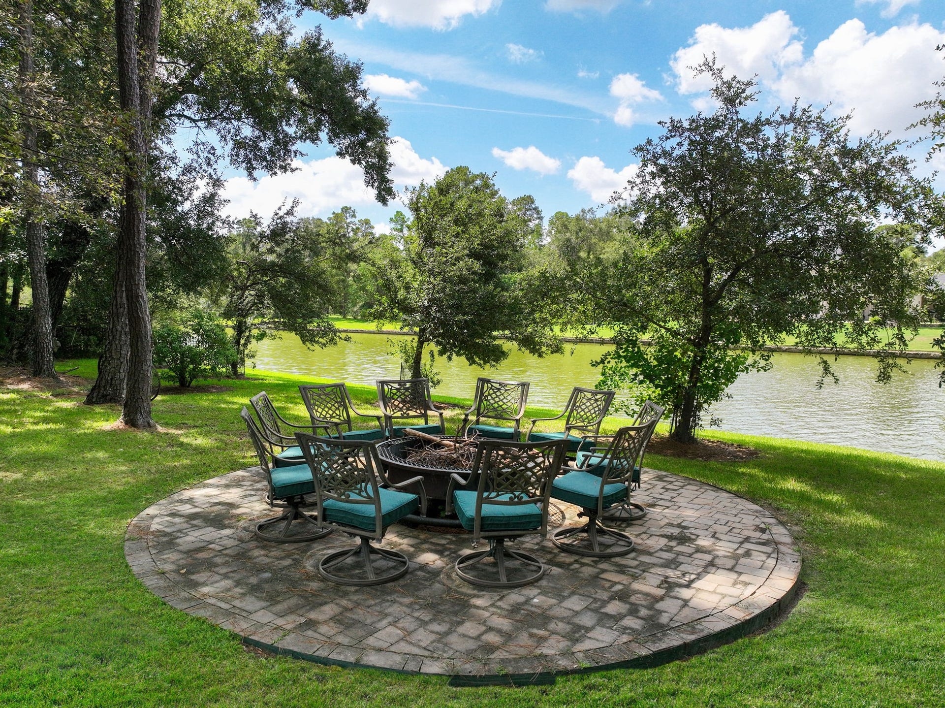Beautiful lakeside paver patio, the perfect setting to relax, unwind, and take in breathtaking sunset views over the water.