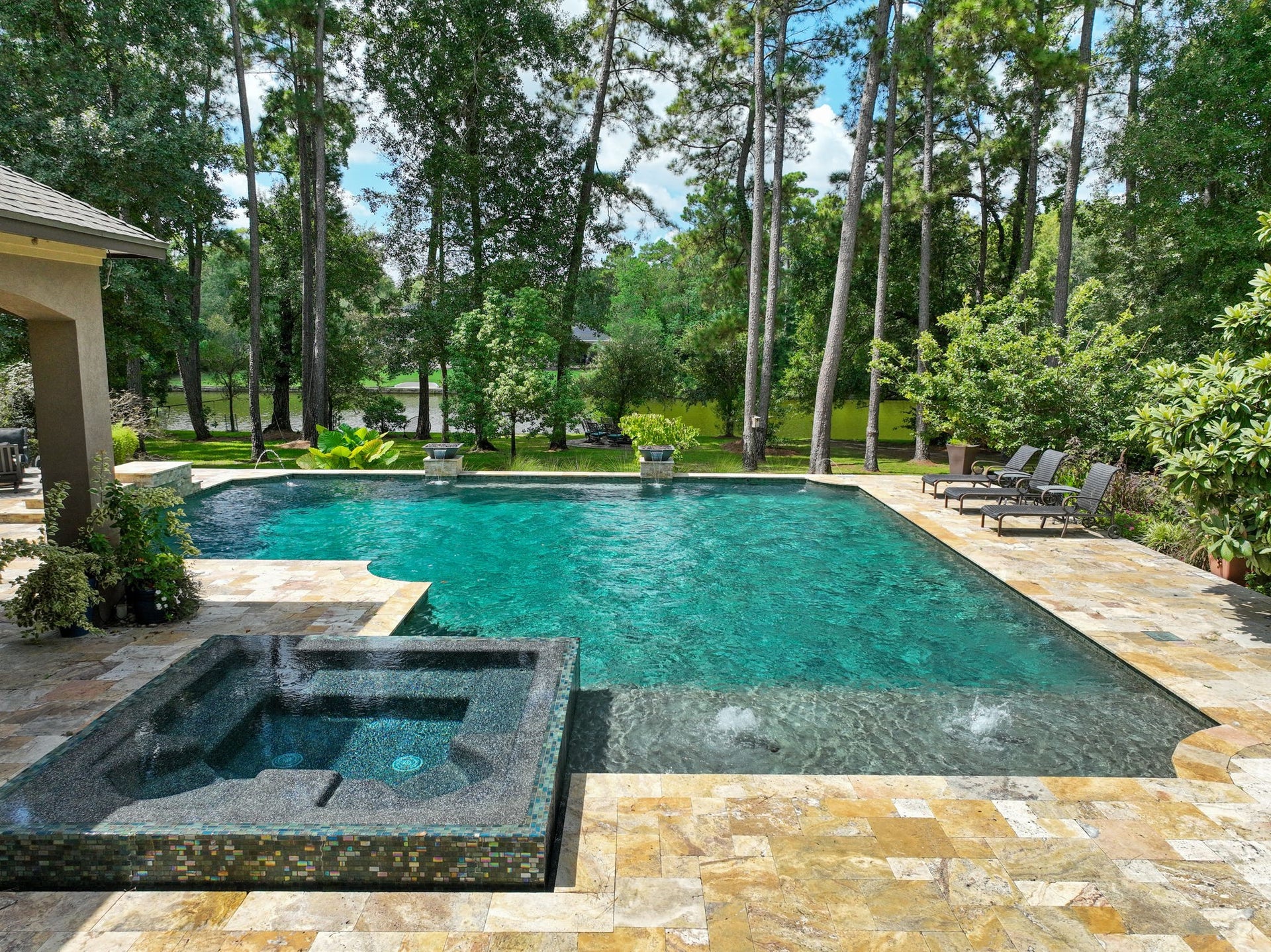 Your piece of Waterfront Serenity! Thoughtfully designed for both entertaining and wellness, this resort-style pool features integrated swim jets, allowing for resistance swimming and low-impact workouts right at home, while overlooking the largest lake in Benders Landing!