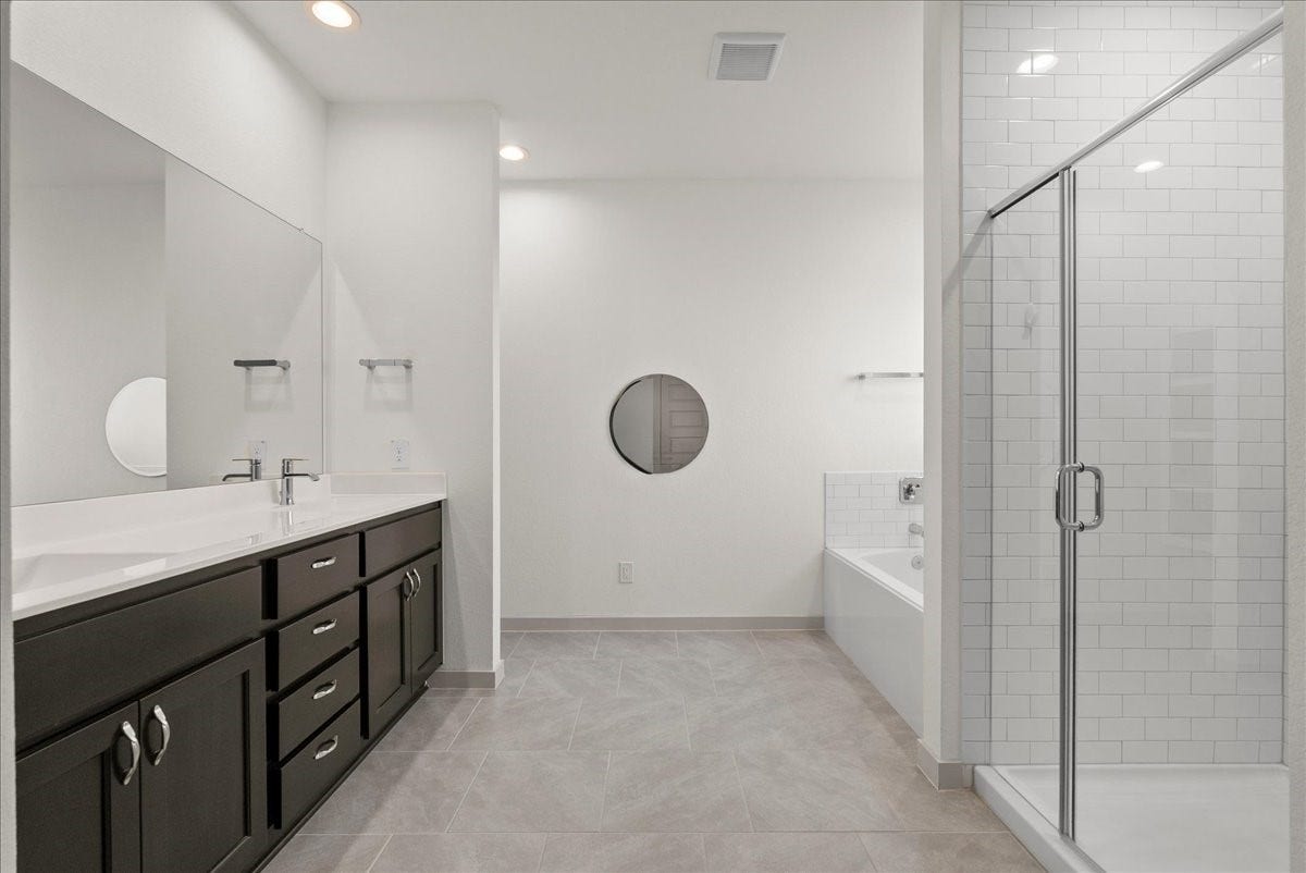716 Westwood Drive, League City, TX 77573 Your own private retreata spacious primary bathroom made for relaxing and recharging.