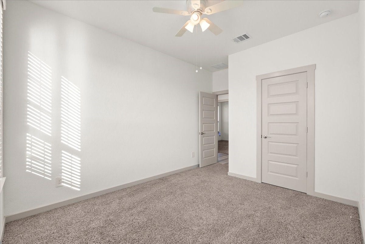 716 Westwood Drive, League City, TX 77573 A comfortable secondary bedroom with plenty of space to make it your own.