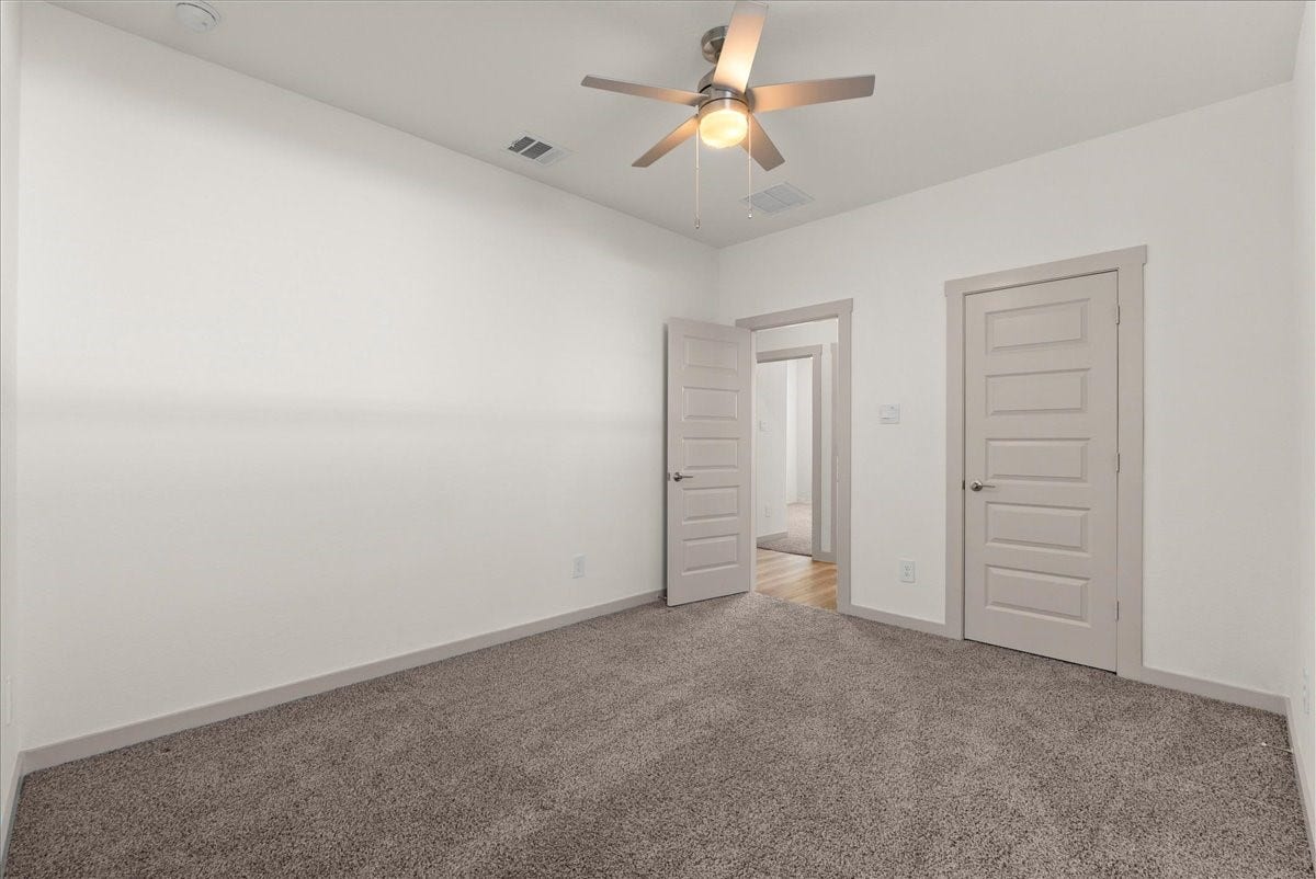 716 Westwood Drive, League City, TX 77573 Bright and inviting, this secondary bedroom offers flexibility for family or guests.