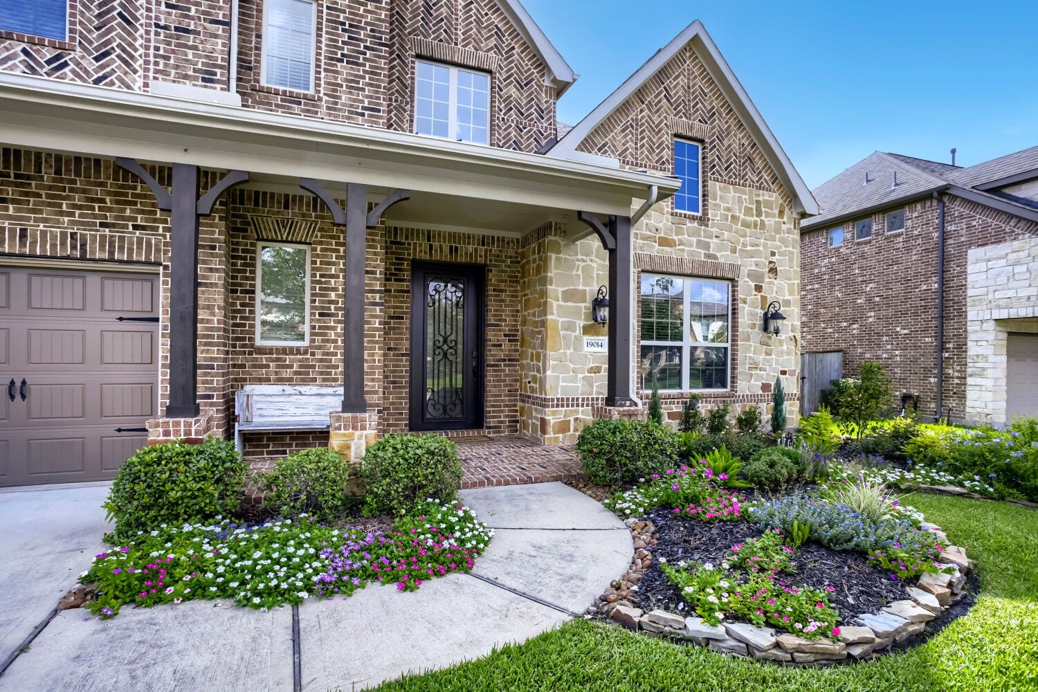 An exceptional first impression awaits you with professionally manicured grounds, elegant landscaping and a beautifully maintained front yard that complements the homes stunning architecture