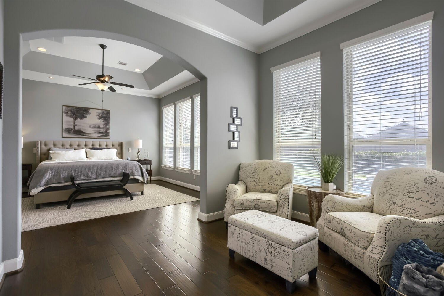 Retreat to the spacious primary suite, thoughtfully designed with a private sitting area-perfect for enjoying your morning coffee, unwinding with a good book or creating a peaceful escape.