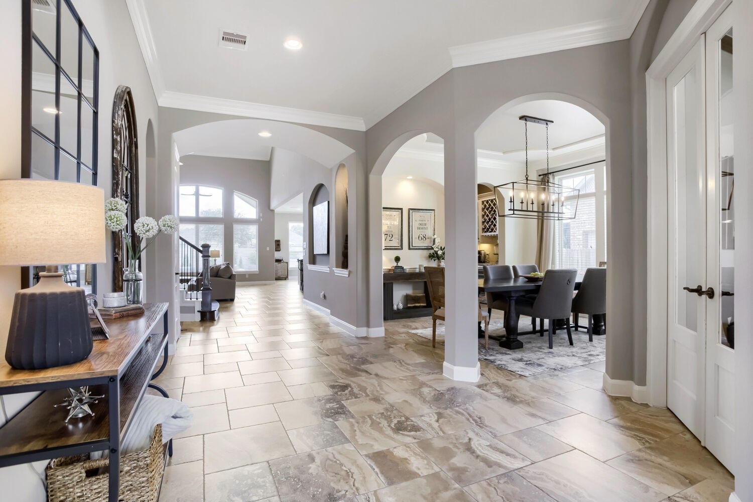 Make a grand first impression with the expansive foyer, featuring an extra wide design that creates and elegant sense of arrival and sets the tone for the home's spacious open layout