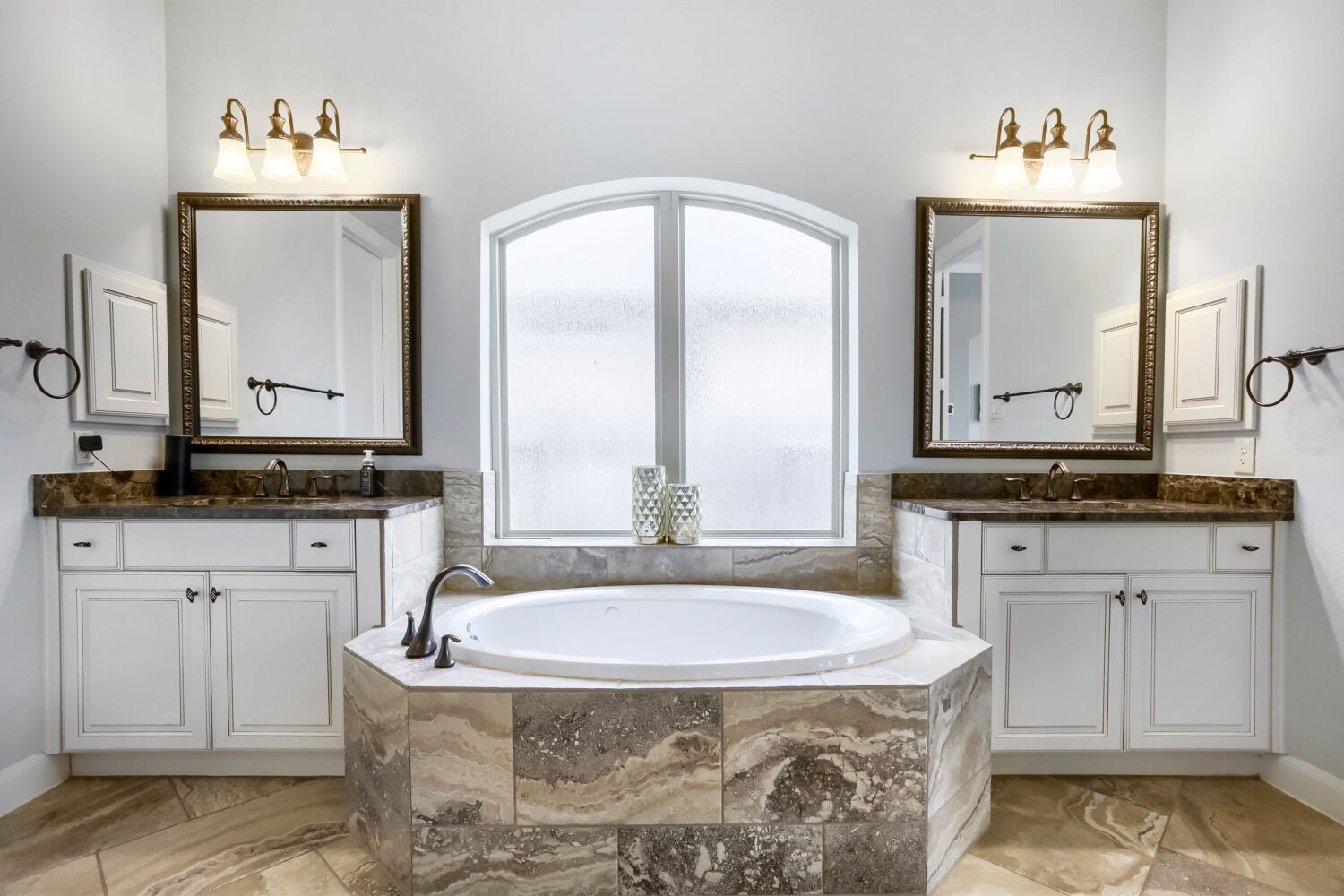 Escape to the exquisite primary bathroom, where a thoughtfully designed wrap around shower, refined details and a calming ambiance create experience. e a true resort-style