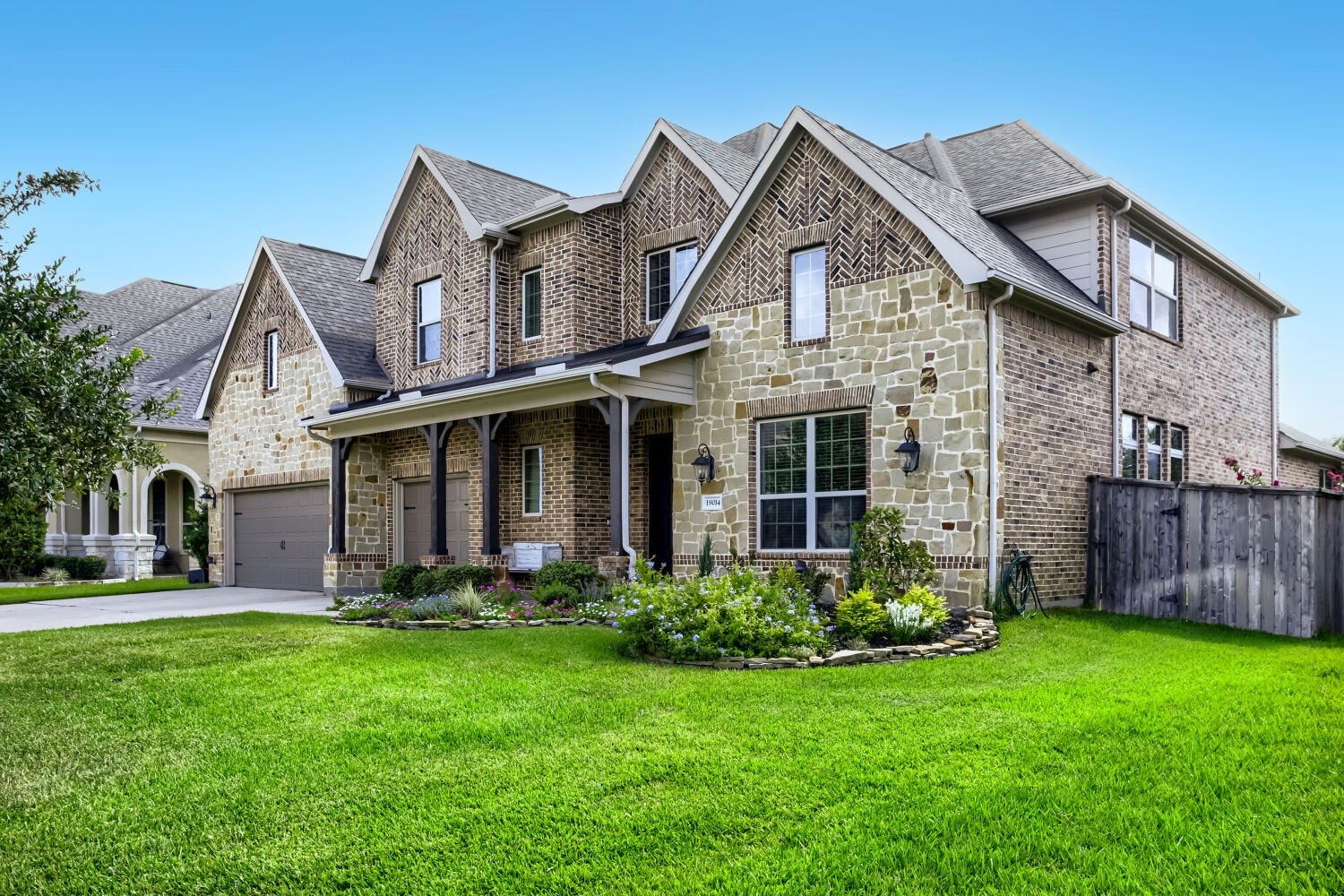 An impressive 3 car garage complements this exceptional home, both funtionality and luxury while enhancing the home's grand presence and timeless appeal