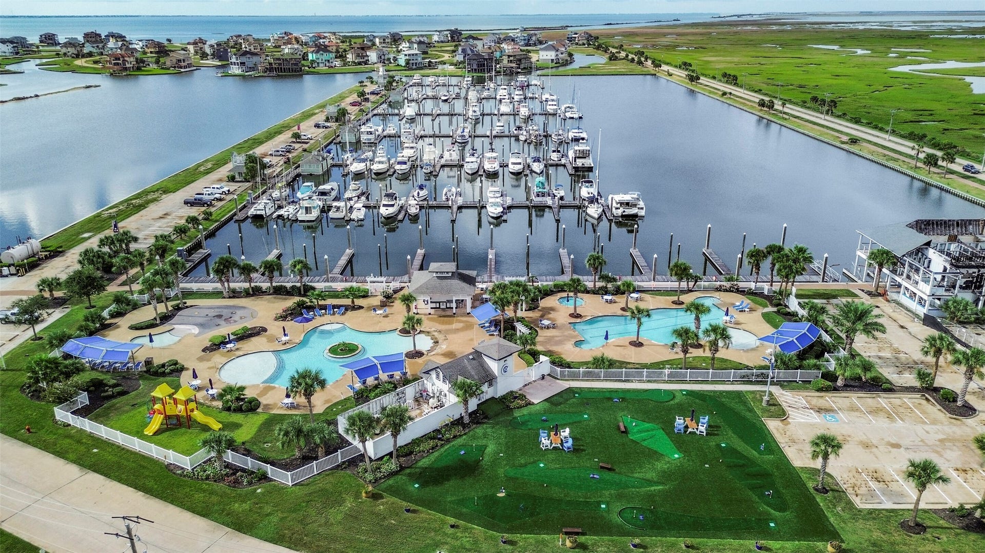 22 Fleming, Hitchcock, TX 77563 An aerial look at the HarborWalk lifestyle, surrounded by waterways, boating amenities and beautiful coastal scenery. This community was designed for those who want to spend more time enjoying life on the water.