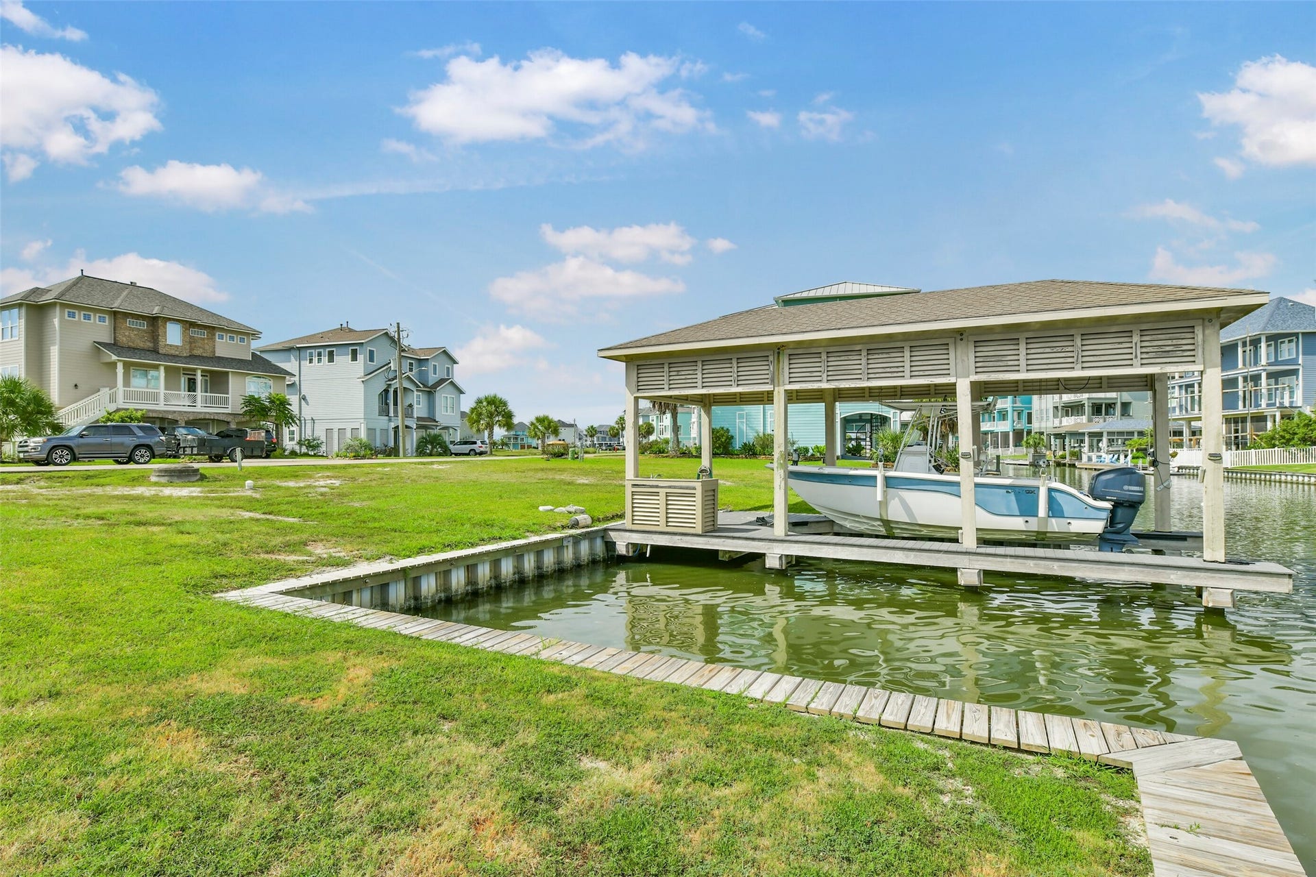 22 Fleming, Hitchcock, TX 77563 The included covered boatlift puts boating and fishing right outside your future home. With electricity and a fish cleaning station already in place, you can start enjoying life on the water while planning your custom build.