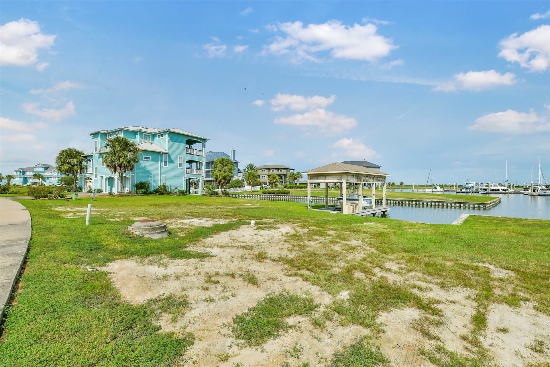 22 Fleming, Hitchcock, TX 77563 Picture your future custom home on this canal front HarborWalk lot with your boat just steps away. The fully constructed boatlift is already in place, giving you a head start on enjoying the waterfront lifestyle.