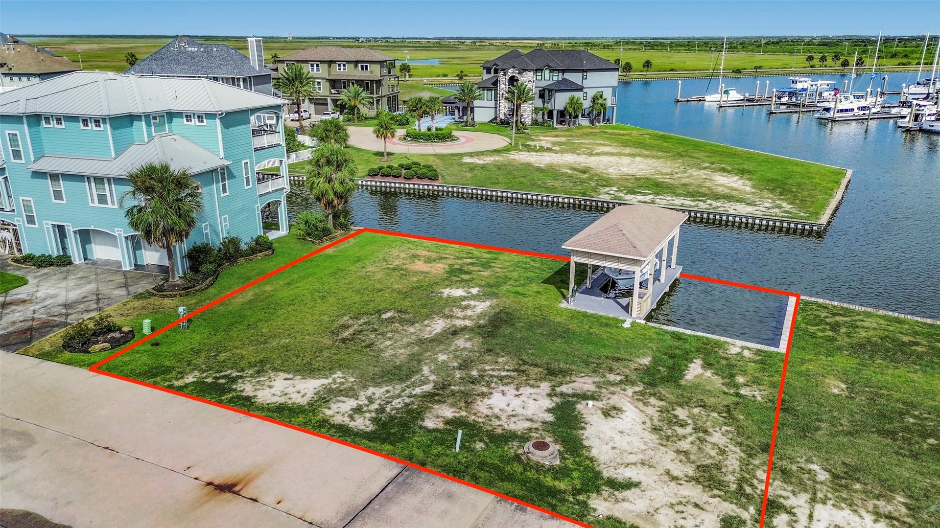 22 Fleming, Hitchcock, TX 77563 This cleared canal front lot offers approximately 6,643 SF with a bulkhead and a fully constructed boatlift already in place. A fantastic head start for creating your custom HarborWalk home.