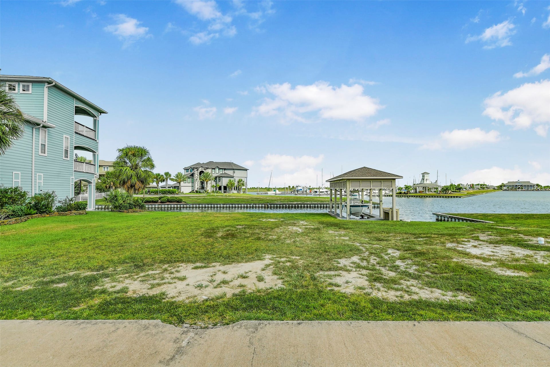 22 Fleming, Hitchcock, TX 77563 A closer look at the fully constructed boatlift included with the property. Electricity and a fish cleaning station make this setup especially appealing for anglers ready to enjoy the HarborWalk lifestyle.
