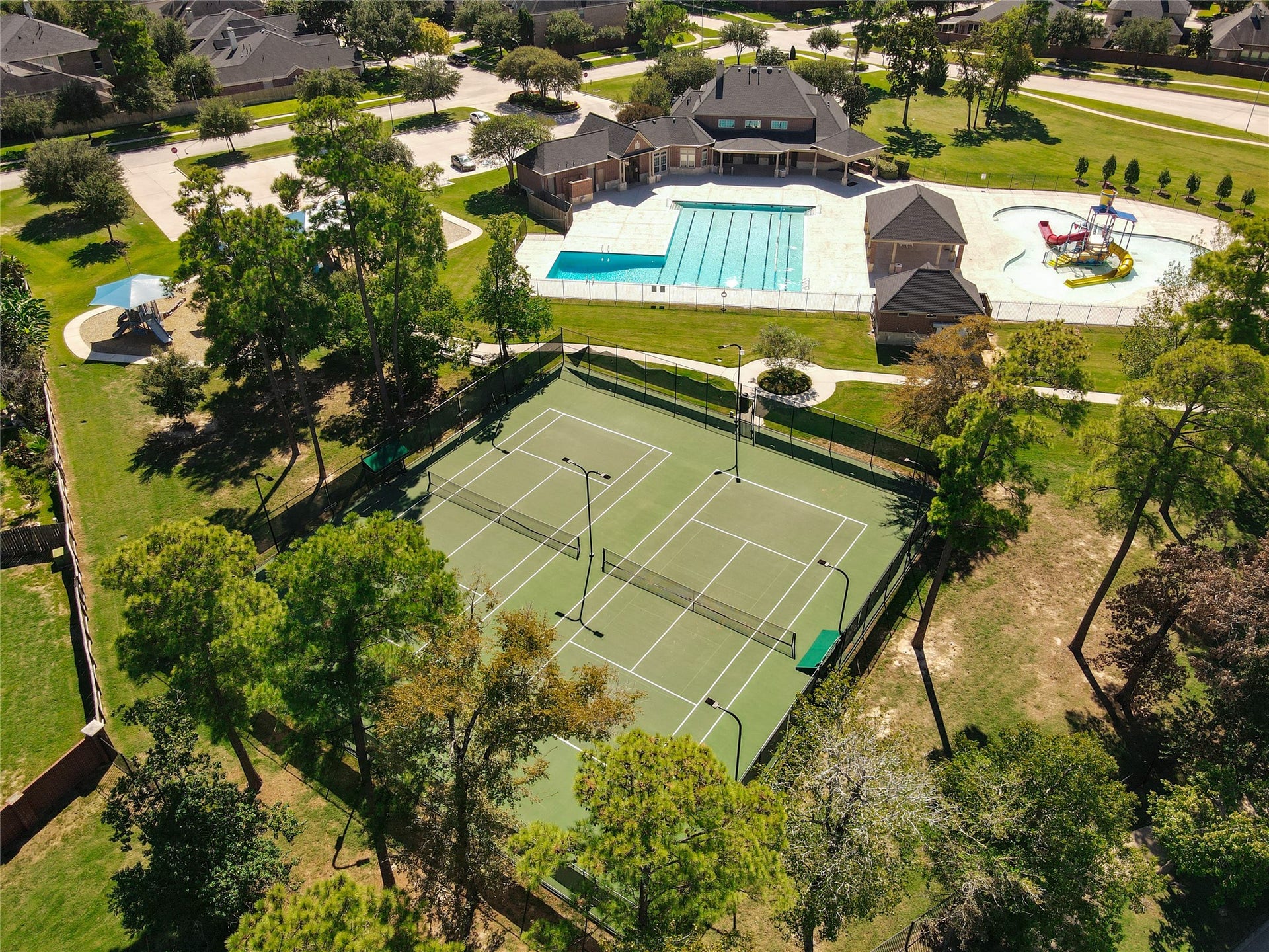 Tennis courts with night lights.