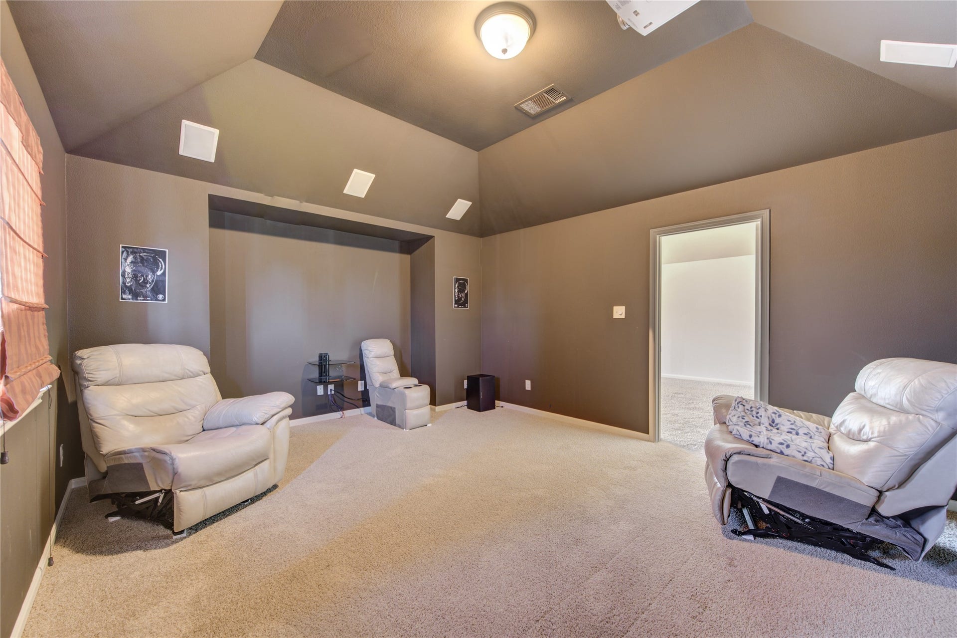 Media room with built in speakers and projector