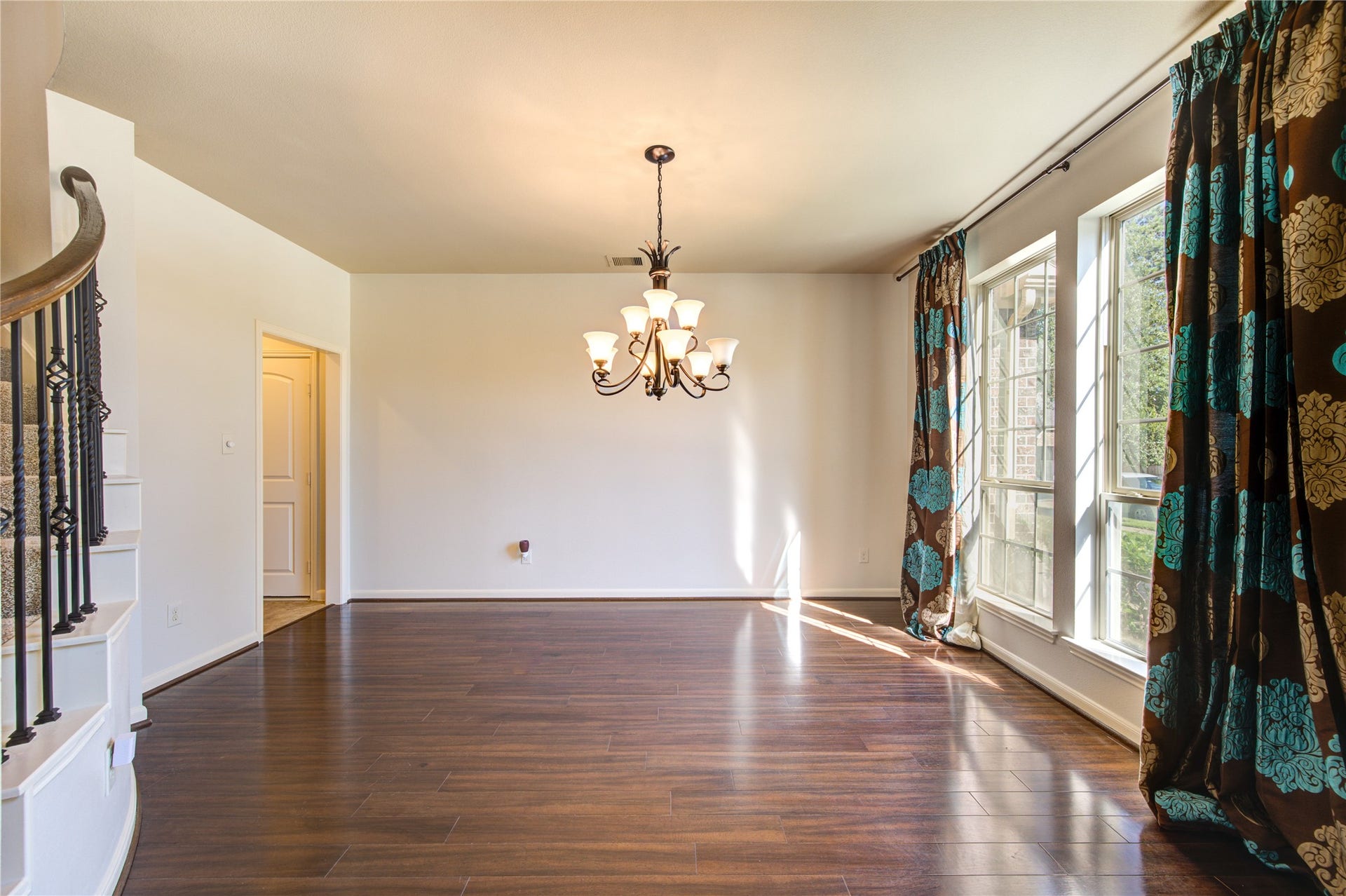 Dining room space with natural light from large front window