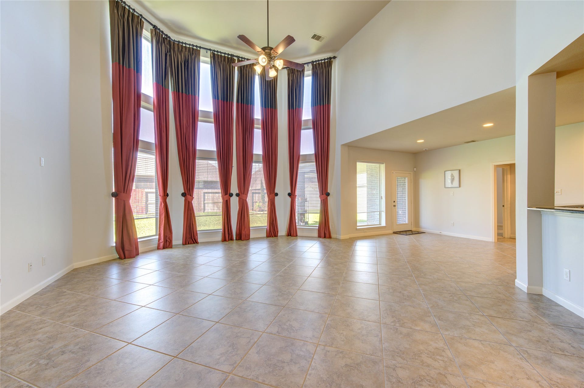 high curtain window wall, large file flooring throughout high traffic areas.