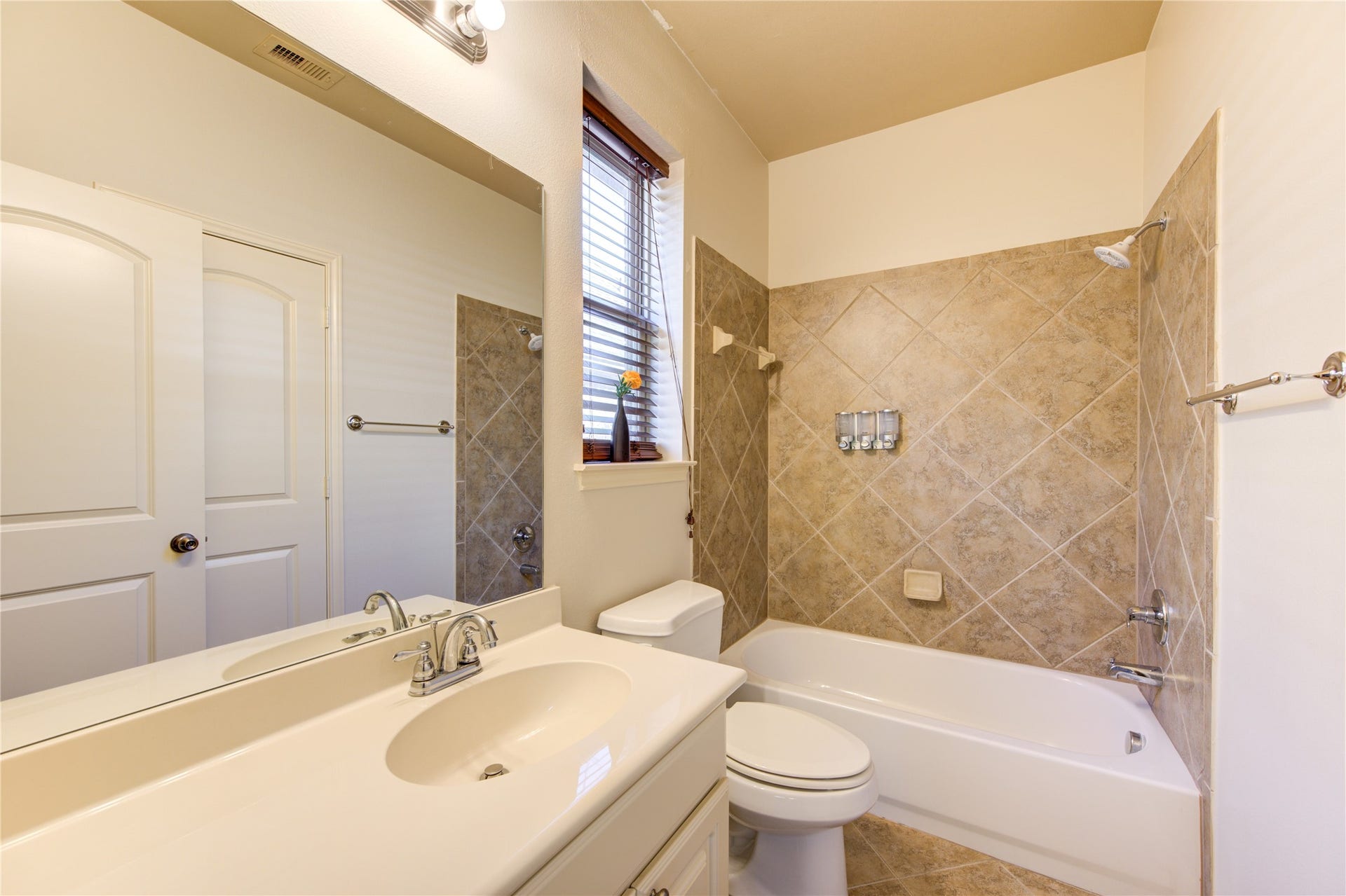 Guest bathroom downstairs with closet.