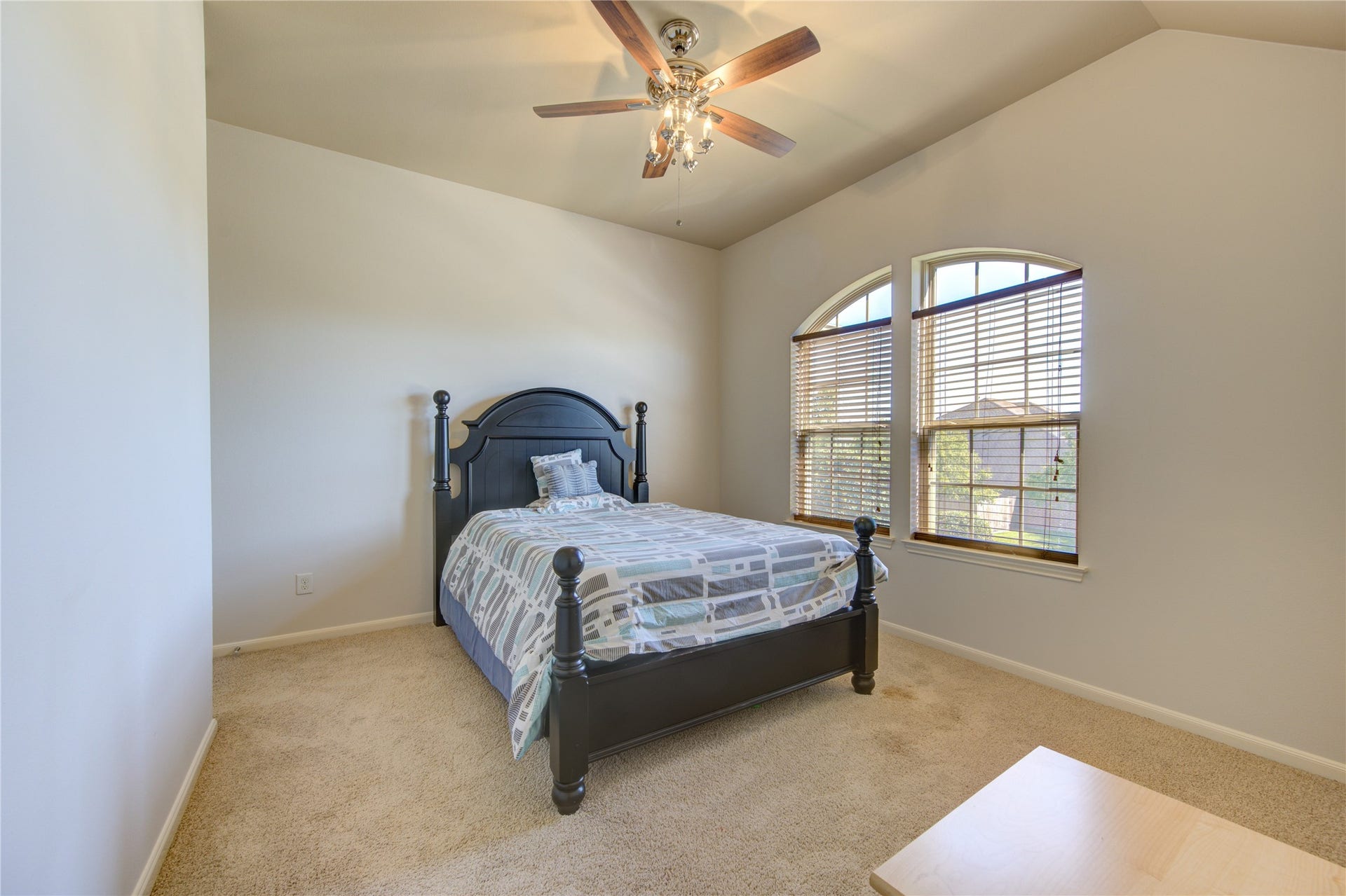 Large space with ceiling fan and views to the front of the house.