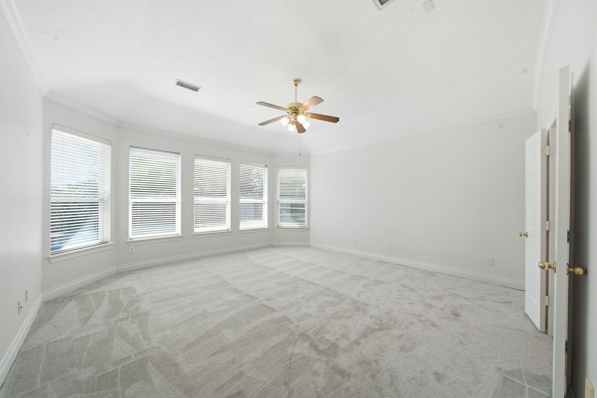 1227 Wellshire Drive, Katy, TX 77494 The primary bedroom enjoys new carpet, a wall of windows for your own private refuge.