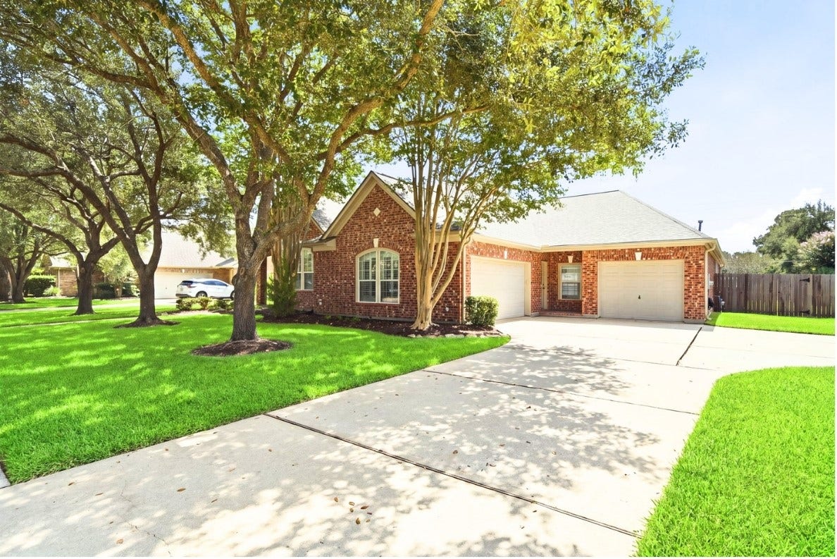 1227 Wellshire Drive, Katy, TX 77494 Oversized lot with three car garage and extended parking space with side entrance.