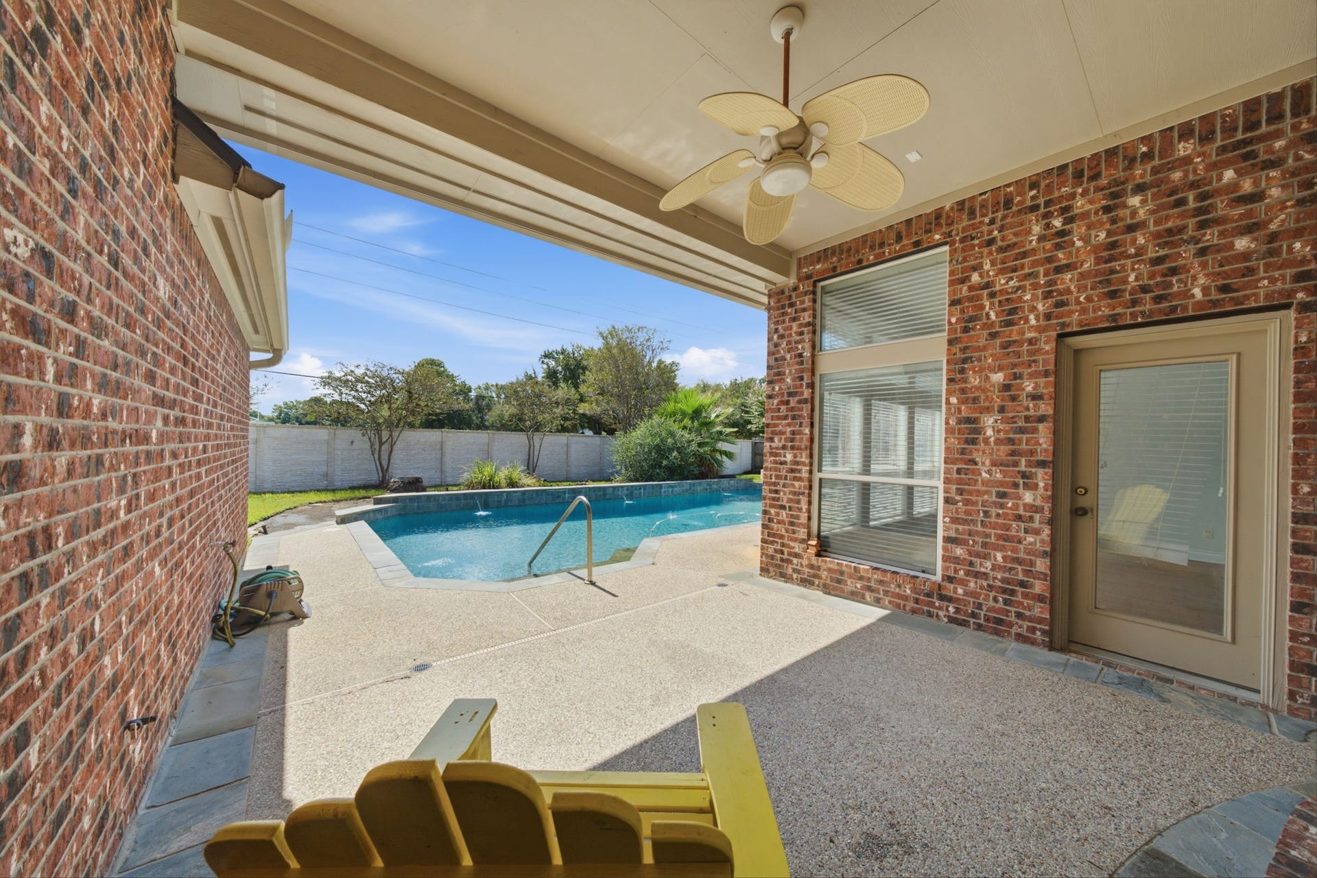 1227 Wellshire Drive, Katy, TX 77494 Shady back patio with space for a dining table and grill if you like to entertain outdoors.