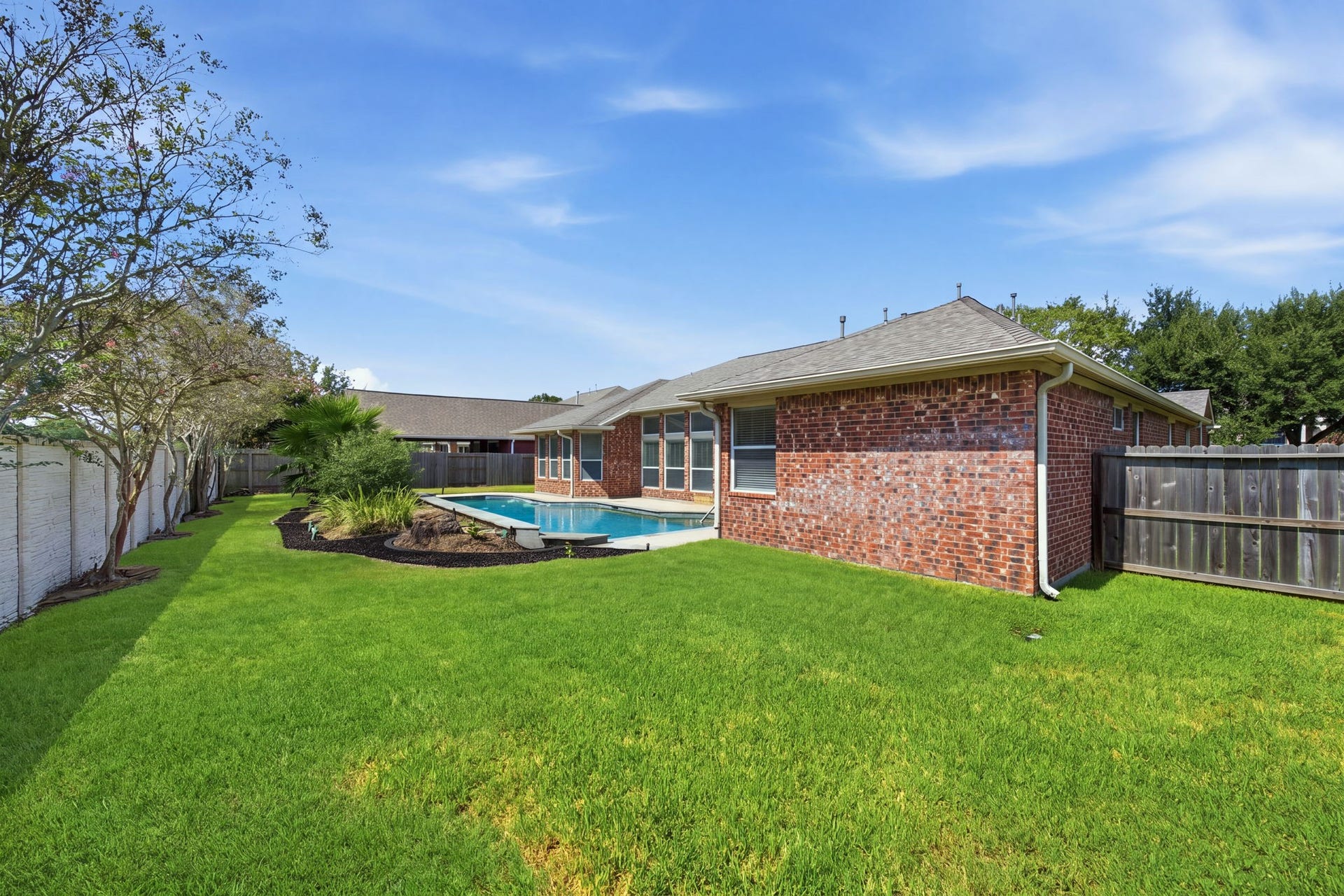 1227 Wellshire Drive, Katy, TX 77494 Even with the pool, there is plenty of green space in this large backyard.