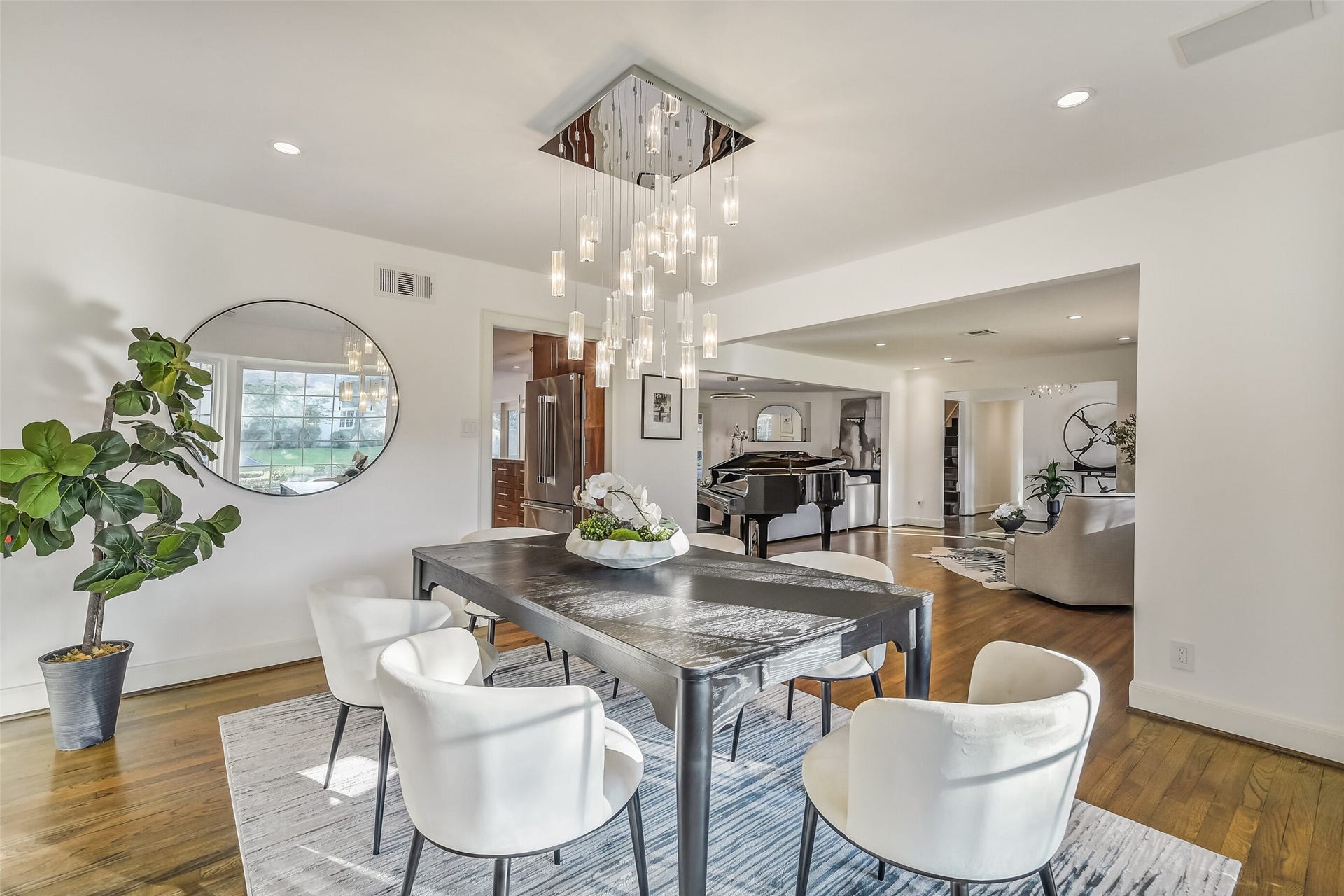 Another view of the spacious formal dining room, seamlessly connected to the formal living and family rooms, with convenient access to the kitchencreating an ideal setting for effortless entertaining and memorable gatherings.