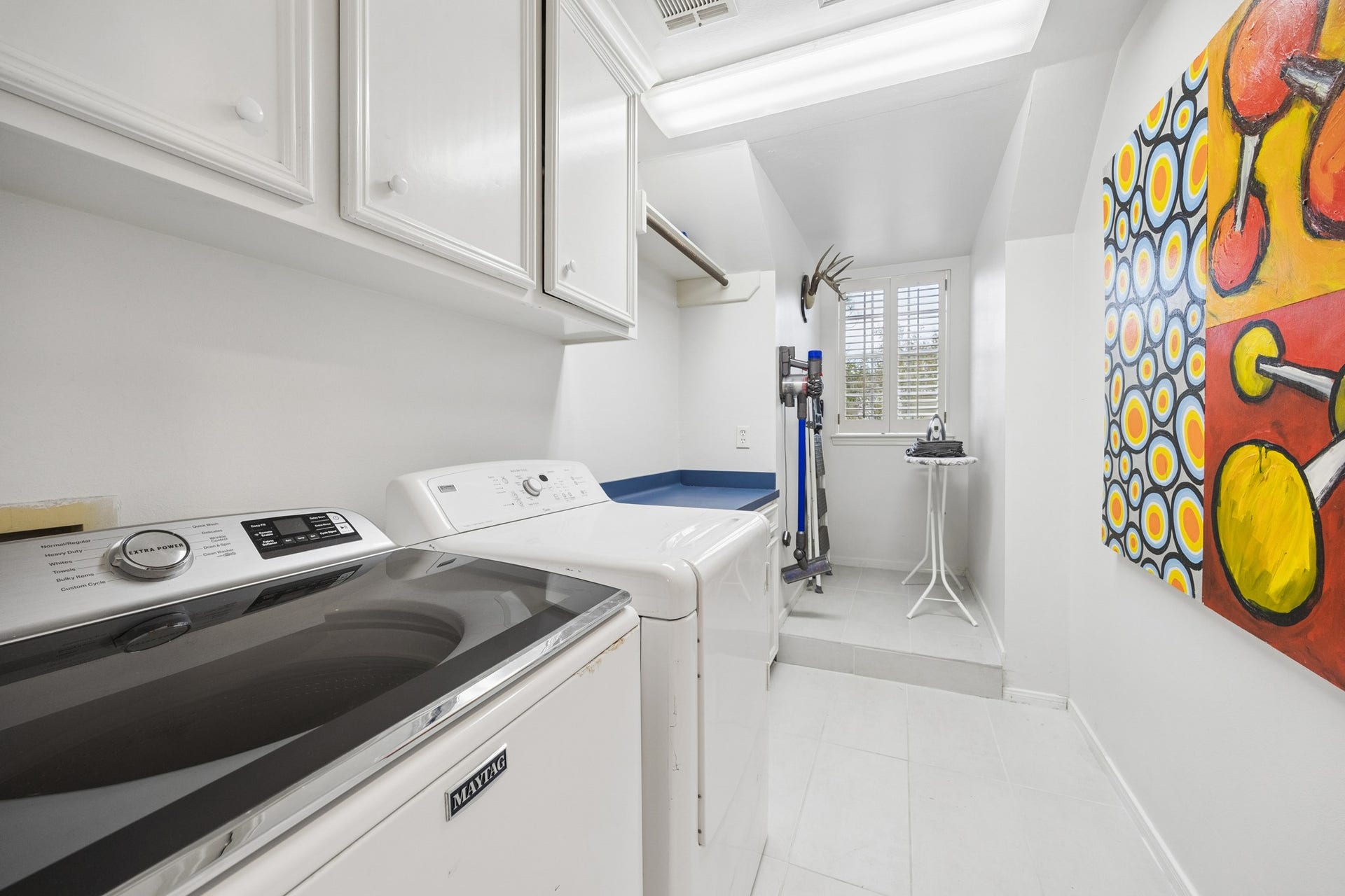 4900 Florence Street, Bellaire, TX 77401 Located on the second floor is the laundry room with extra storage and space to iron.