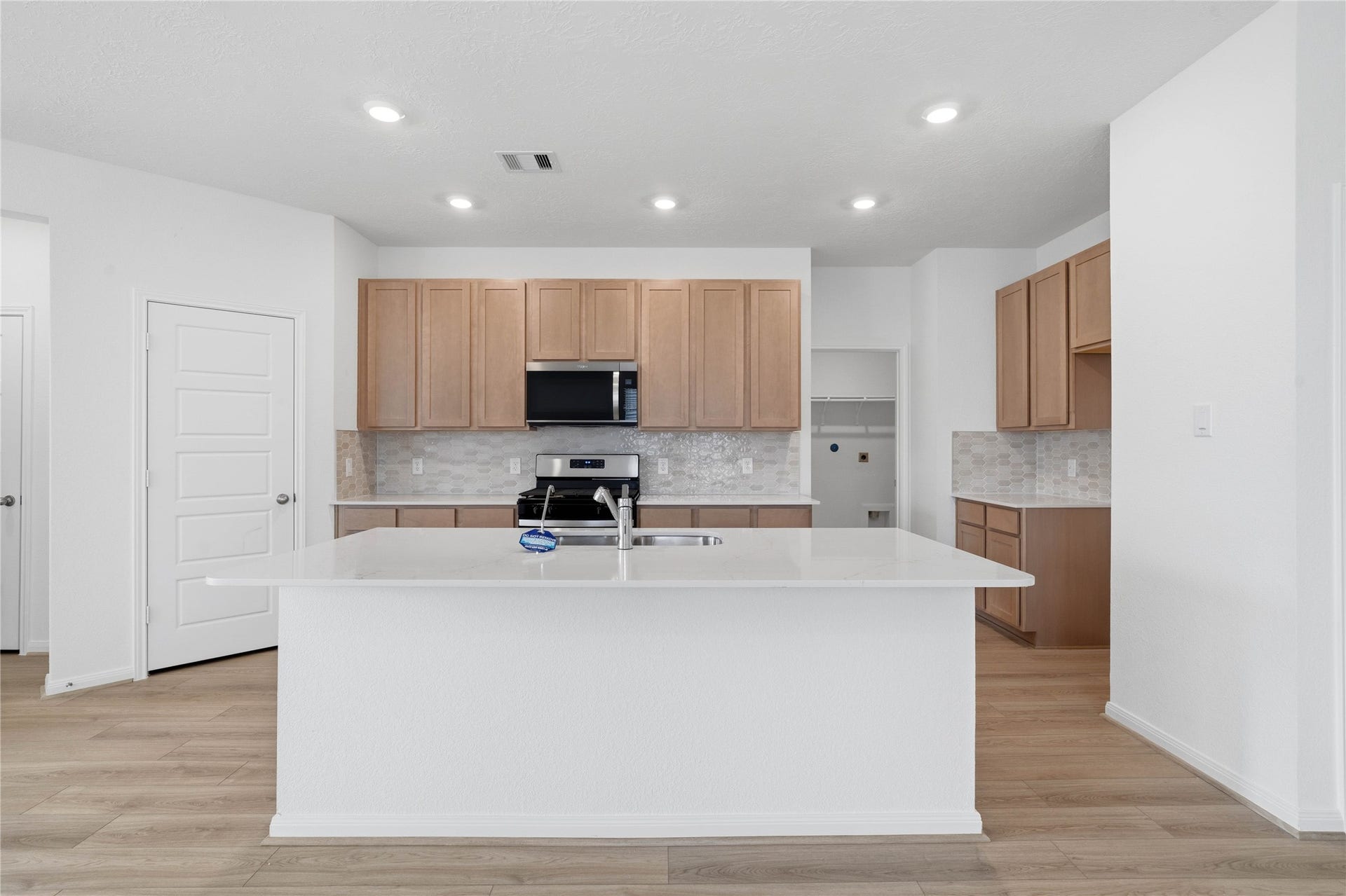 3039 Cronus Way, Fresno, TX 77545 This spacious kitchen has it allample storage, generous counter space, and a layout that truly makes it the heart of the home.