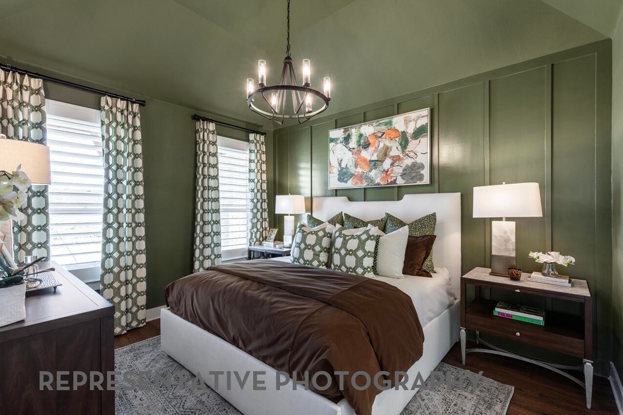 3435 Loam Lane, Richmond, TX 77406 A cozy primary bedroom features soft natural light streaming through its windows, creating a calm and restful retreat.