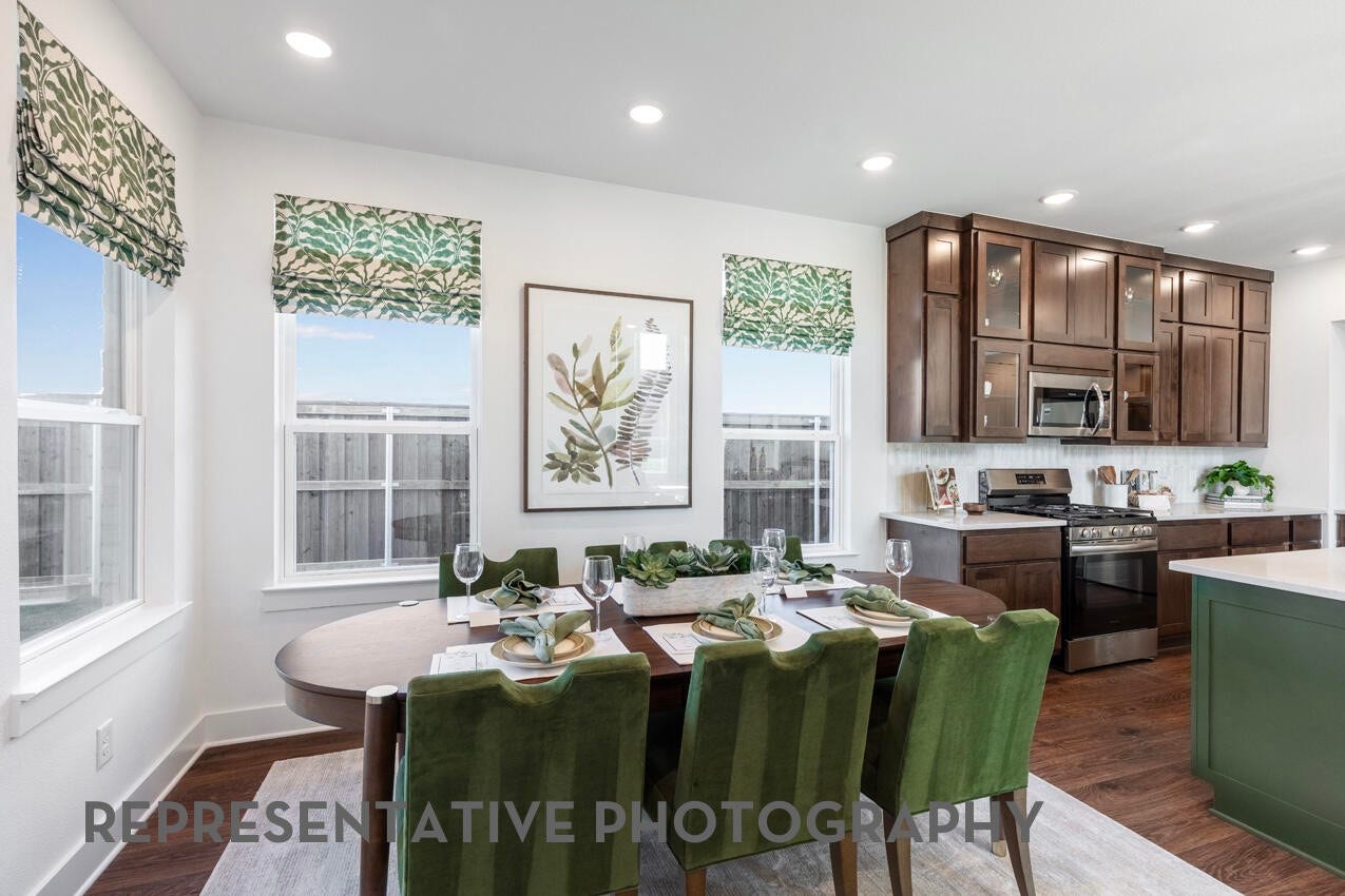 3435 Loam Lane, Richmond, TX 77406 A dining area located next to the kitchen provides a convenient and welcoming space for gathering and sharing meals together.