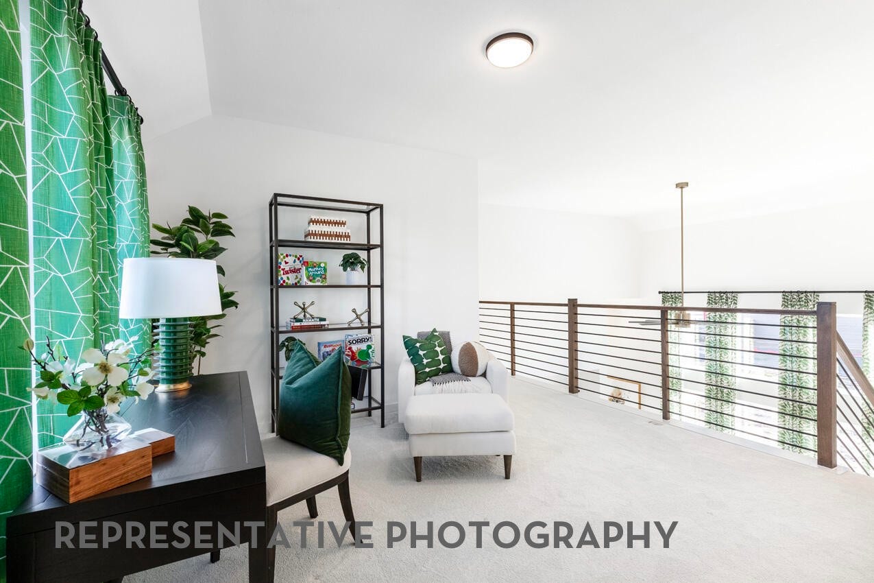 3435 Loam Lane, Richmond, TX 77406 A loft open to the family room below creates a bright, connected space that enhances openness and flow throughout the home.