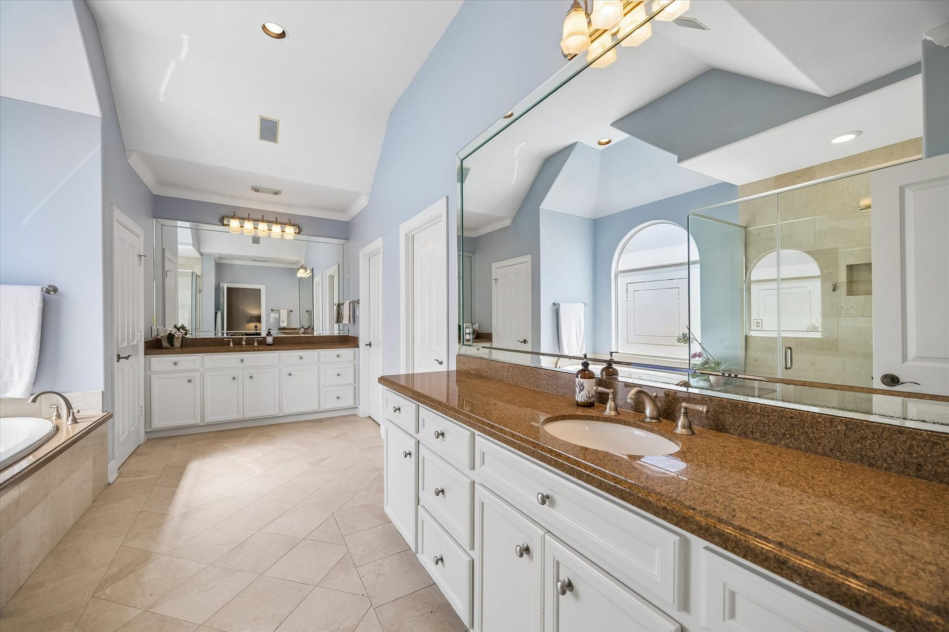 Primary Bath: two sink area, jetted tub, separate shower.