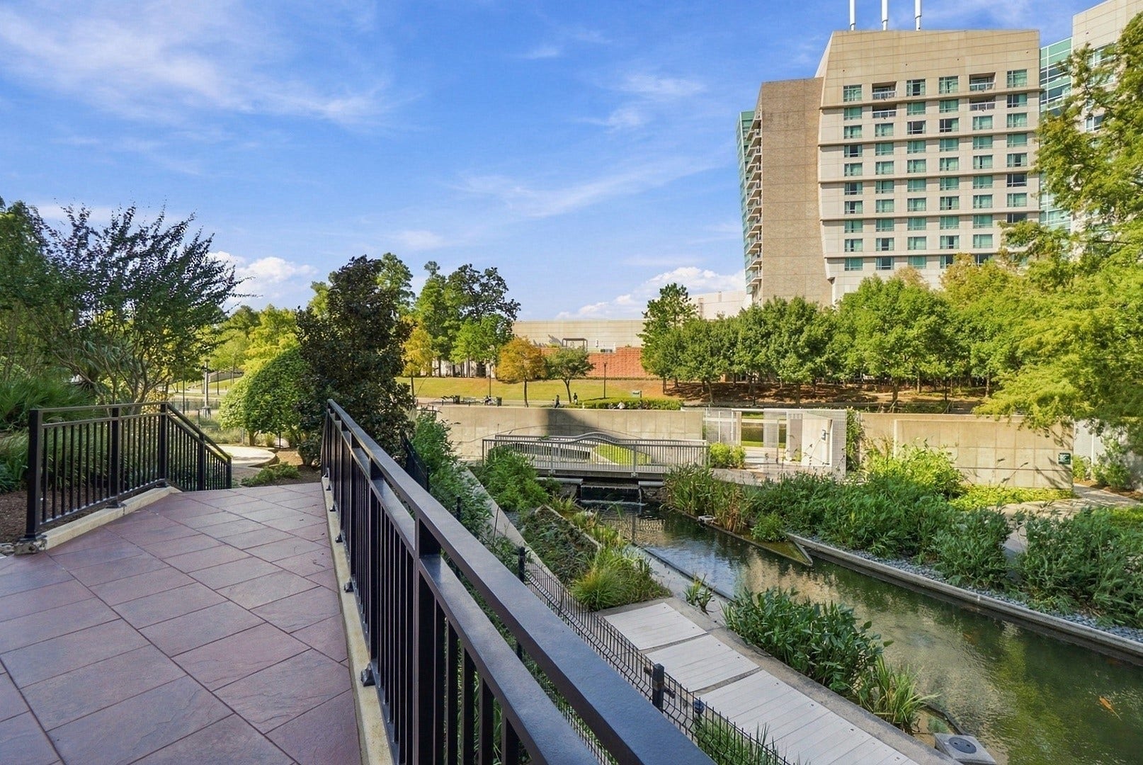 3 Waterway Court, #2D, The Woodlands, TX 77380 Scenic waterfront pathways wind through beautifully maintained landscaping, perfect for enjoying the outdoors.