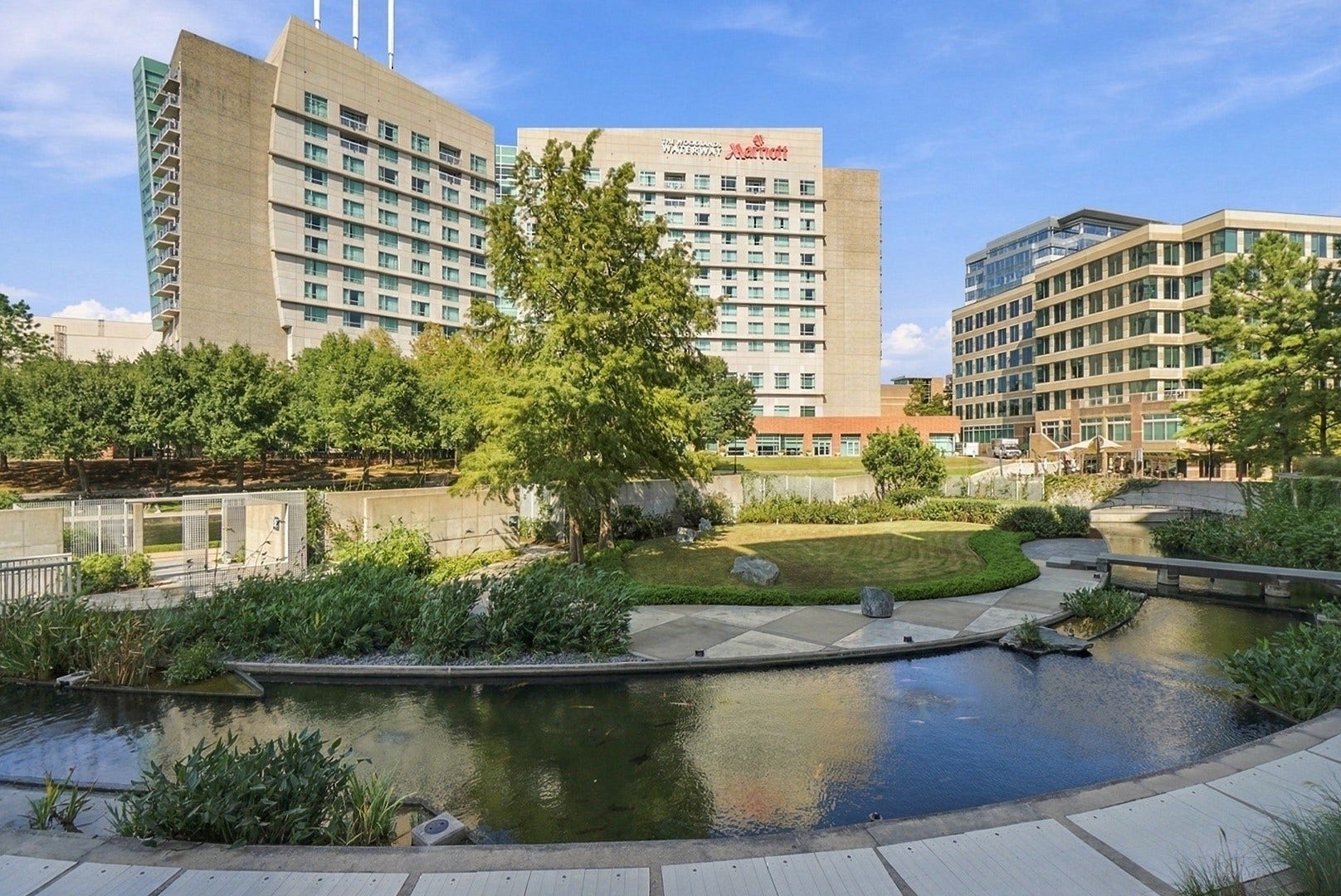 3 Waterway Court, #2D, The Woodlands, TX 77380 Picturesque Waterway views showcase the beautiful blend of nature, architecture, and urban living.