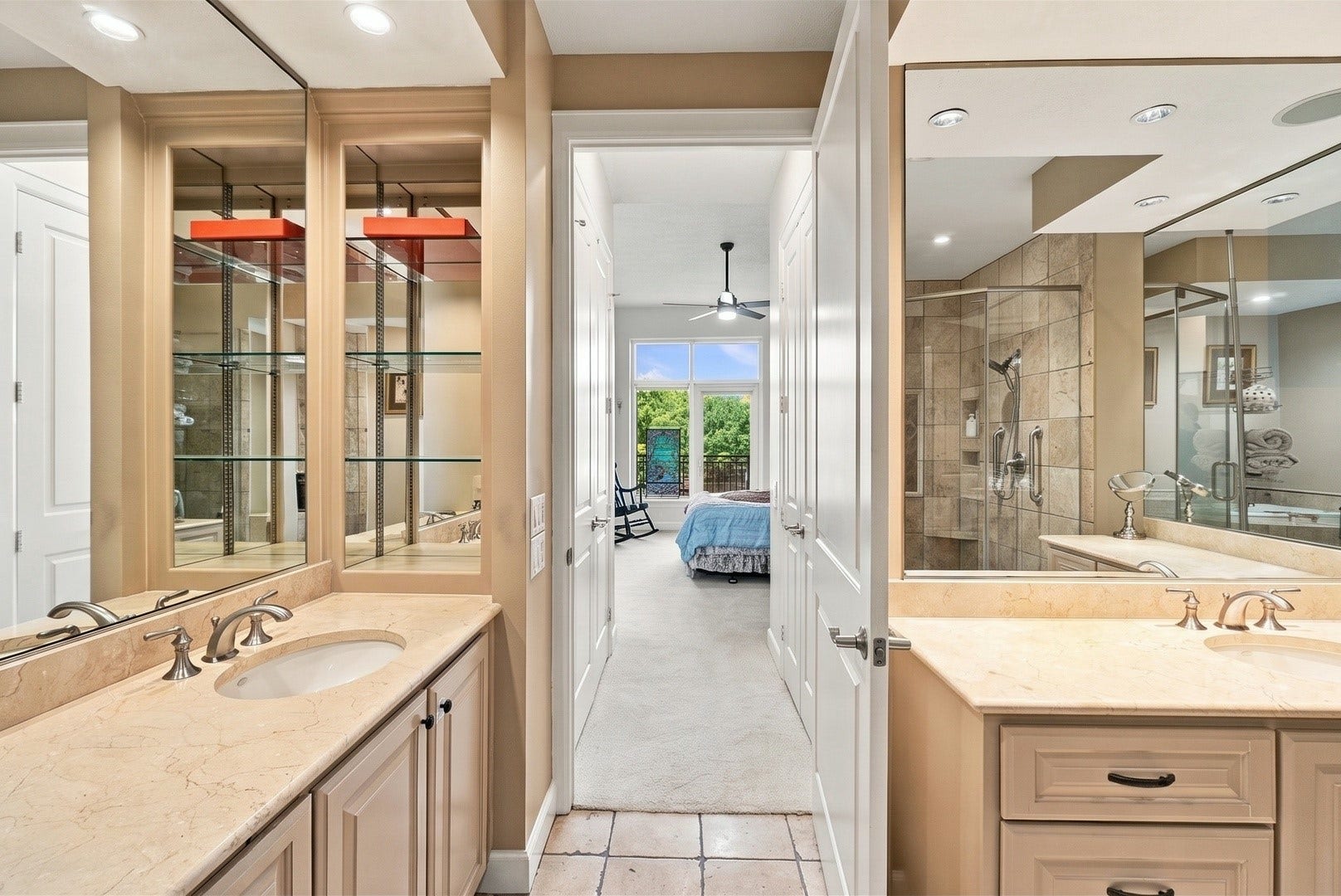 3 Waterway Court, #2D, The Woodlands, TX 77380 Thoughtfully designed bathroom with dual vanities, generous counter space, and timeless finishes.