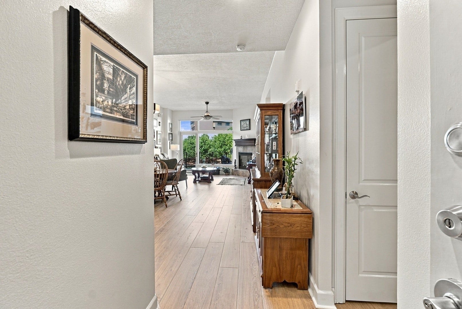 3 Waterway Court, #2D, The Woodlands, TX 77380 Welcoming entry with beautiful wood flooring and a seamless transition into the main living area.